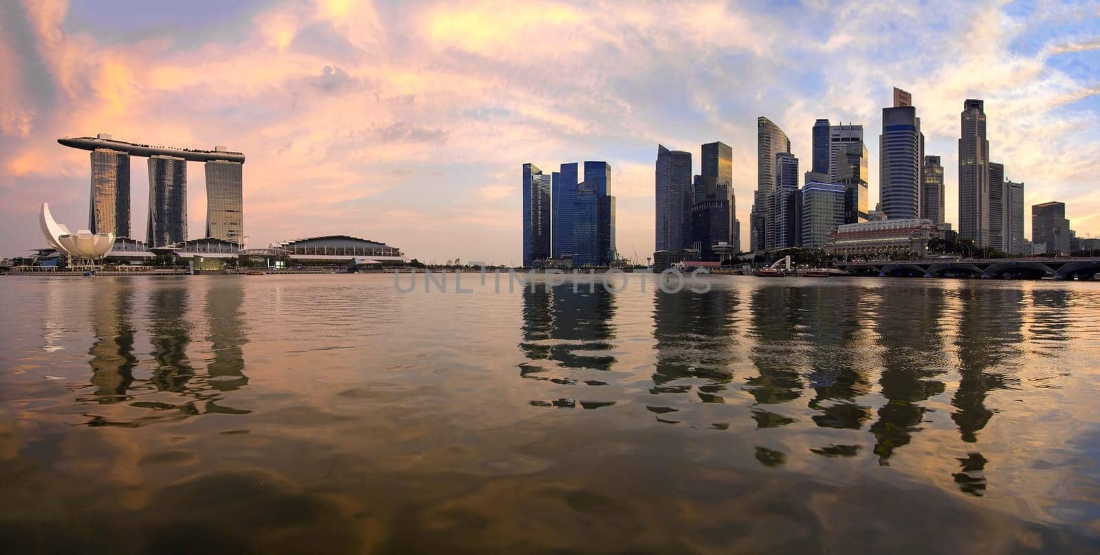 Reflection of Singapore Central Business District Skyline Along Singapore River at Sunset Panorama