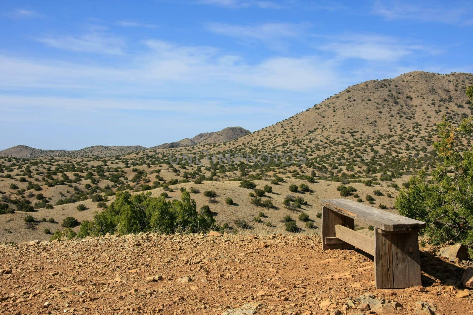 A wooden bench on a summit in Cerillos Hills State Park