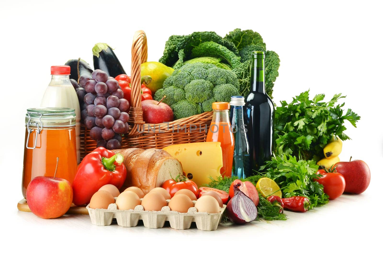 Grocery products including vegetables, fruits, dairy, bread and drinks isolated on white