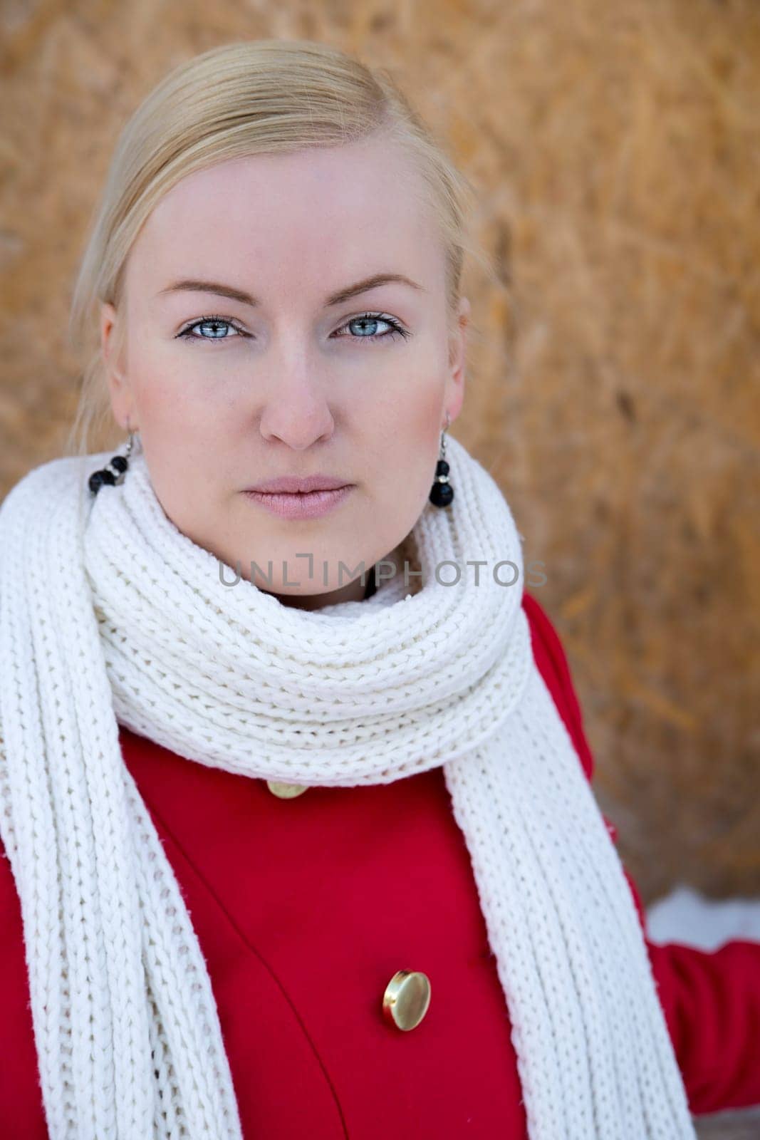 Zoomed young woman face watch focused on camera