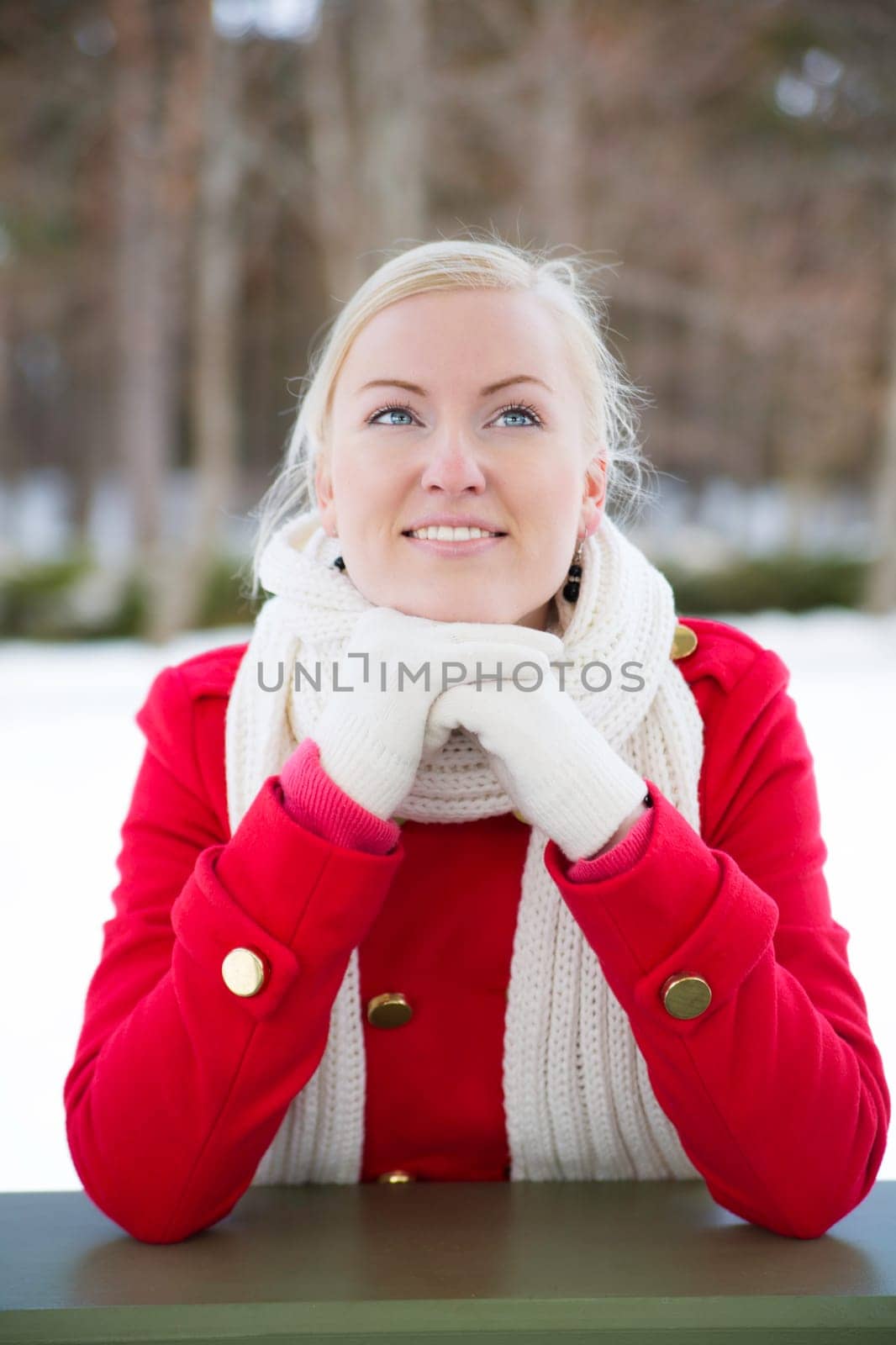 Woman relies at terrace boundary dreaming about somethink