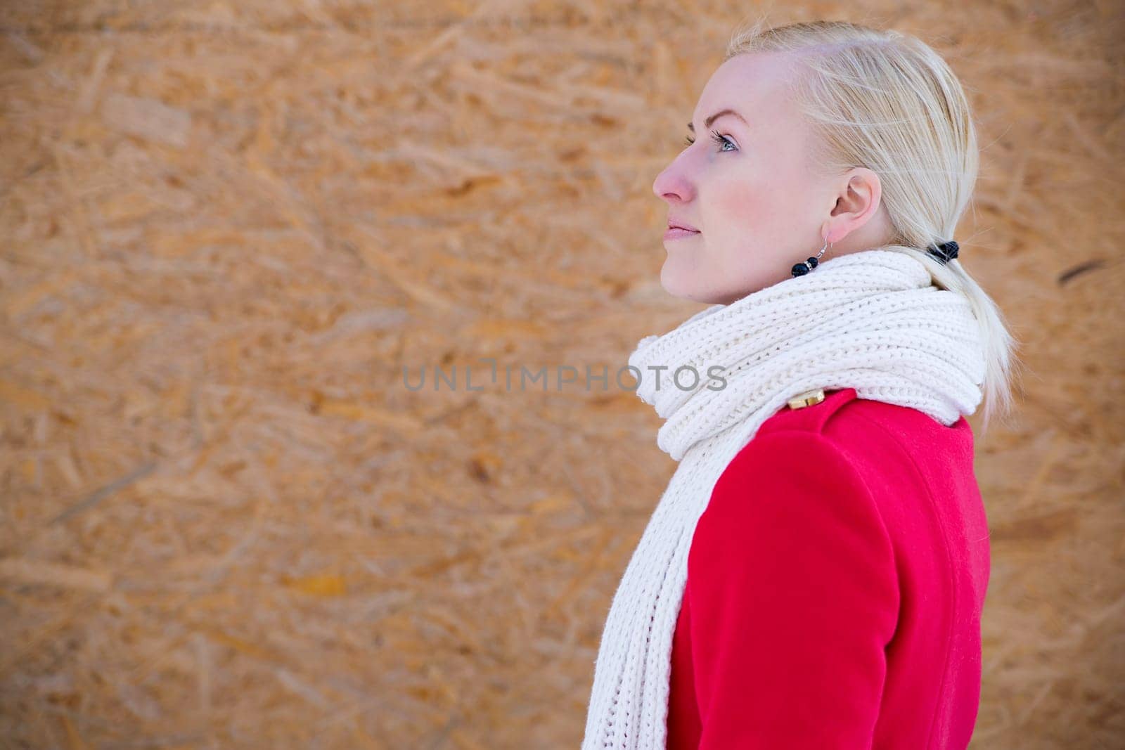 Young woman face profile with white woven scarf