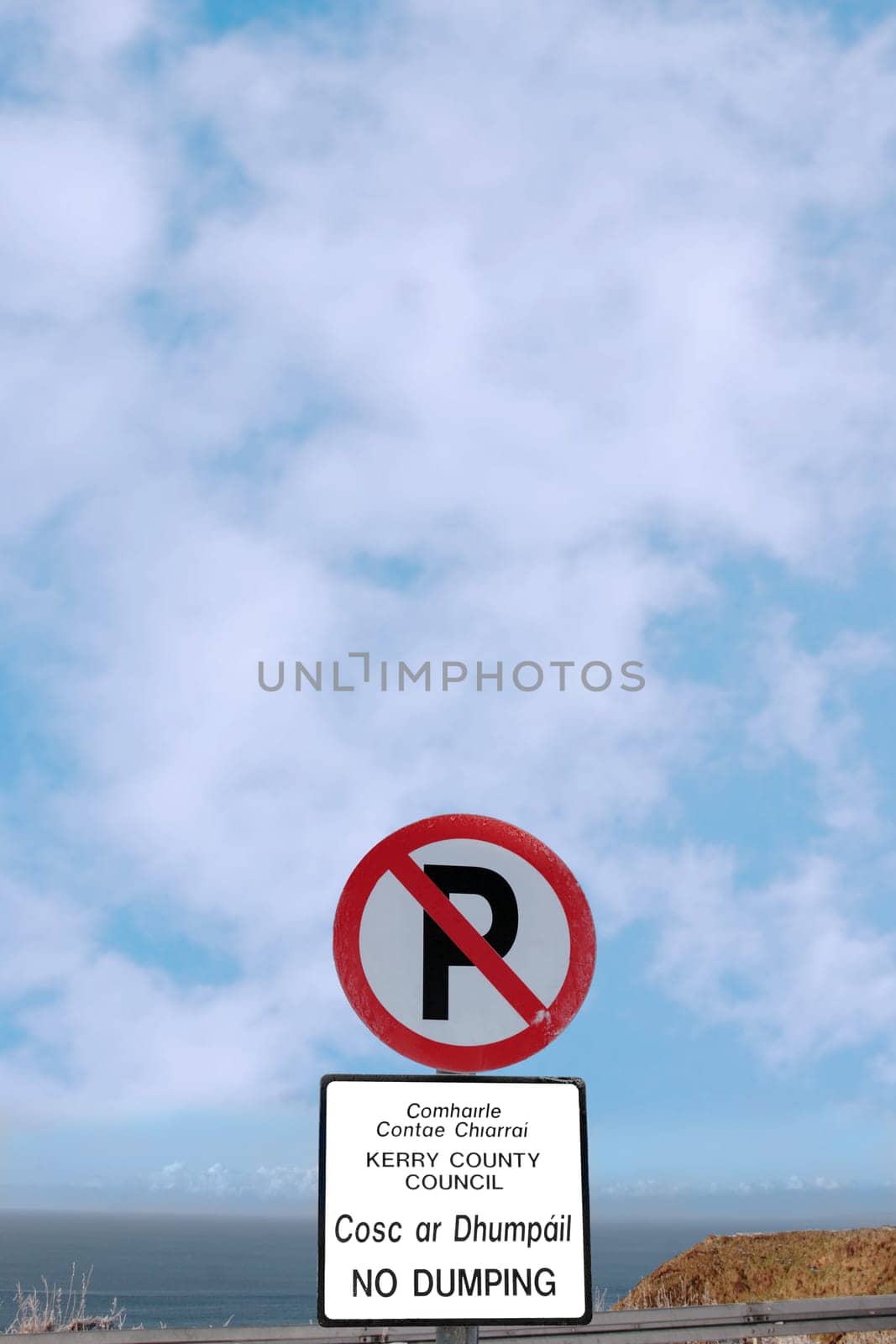 no parking and no dumping sign on a cliff edge in ballybunion county kerry ireland