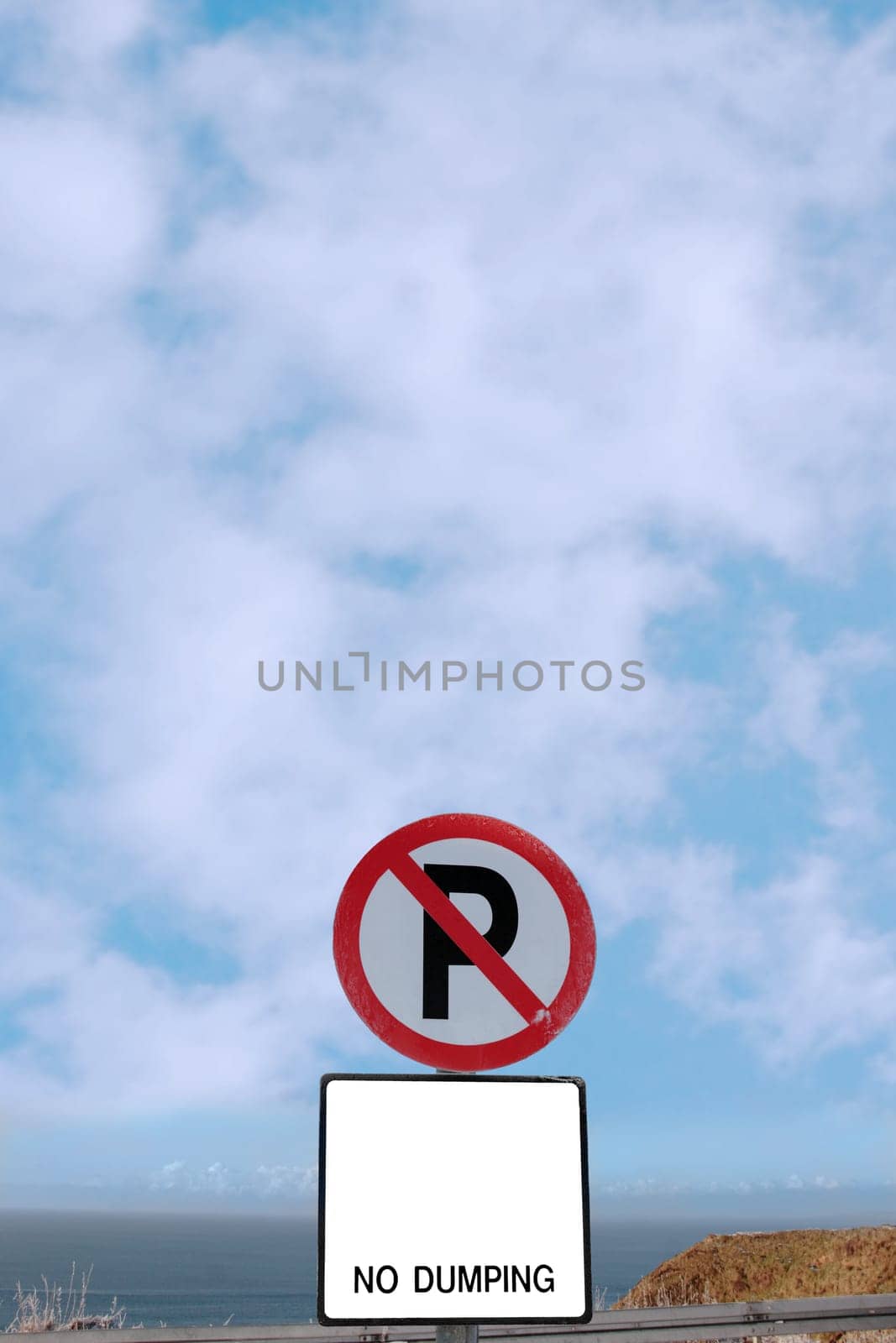 no parking and no dumping sign on a cliff edge in ballybunion ireland