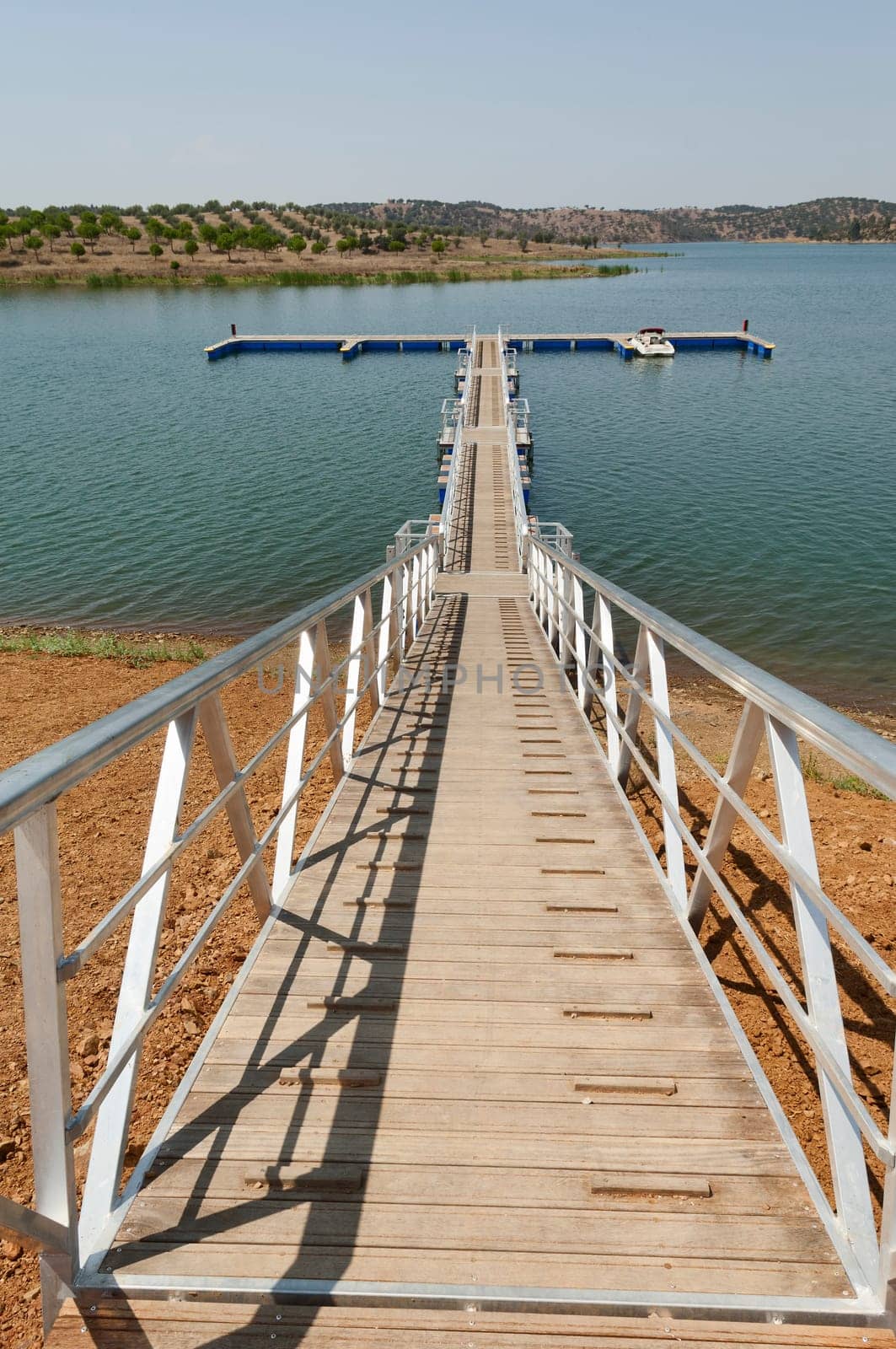 Wooden walkway serving Amieira pier on the banks of the reservoir of Alqueva, Alentejo, Portugal