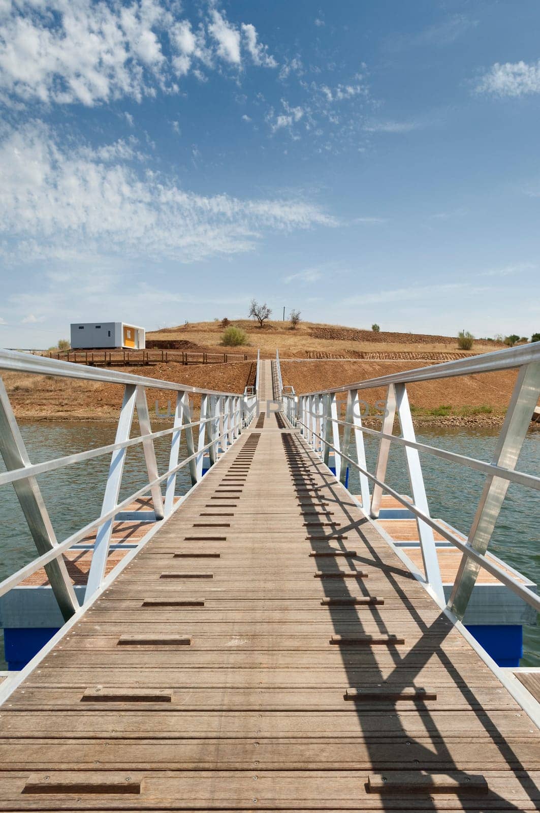 Wooden walkway serving Amieira pier on the banks of the reservoir of Alqueva, Alentejo, Portugal