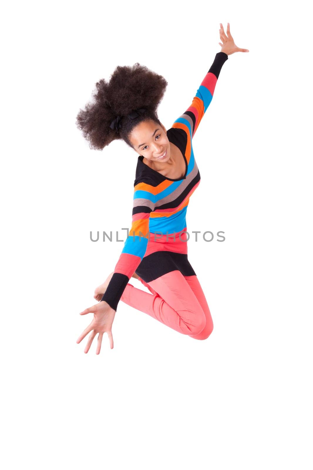 Black African American teenage girl with a afro haircut jumping of joy, isolated on white background