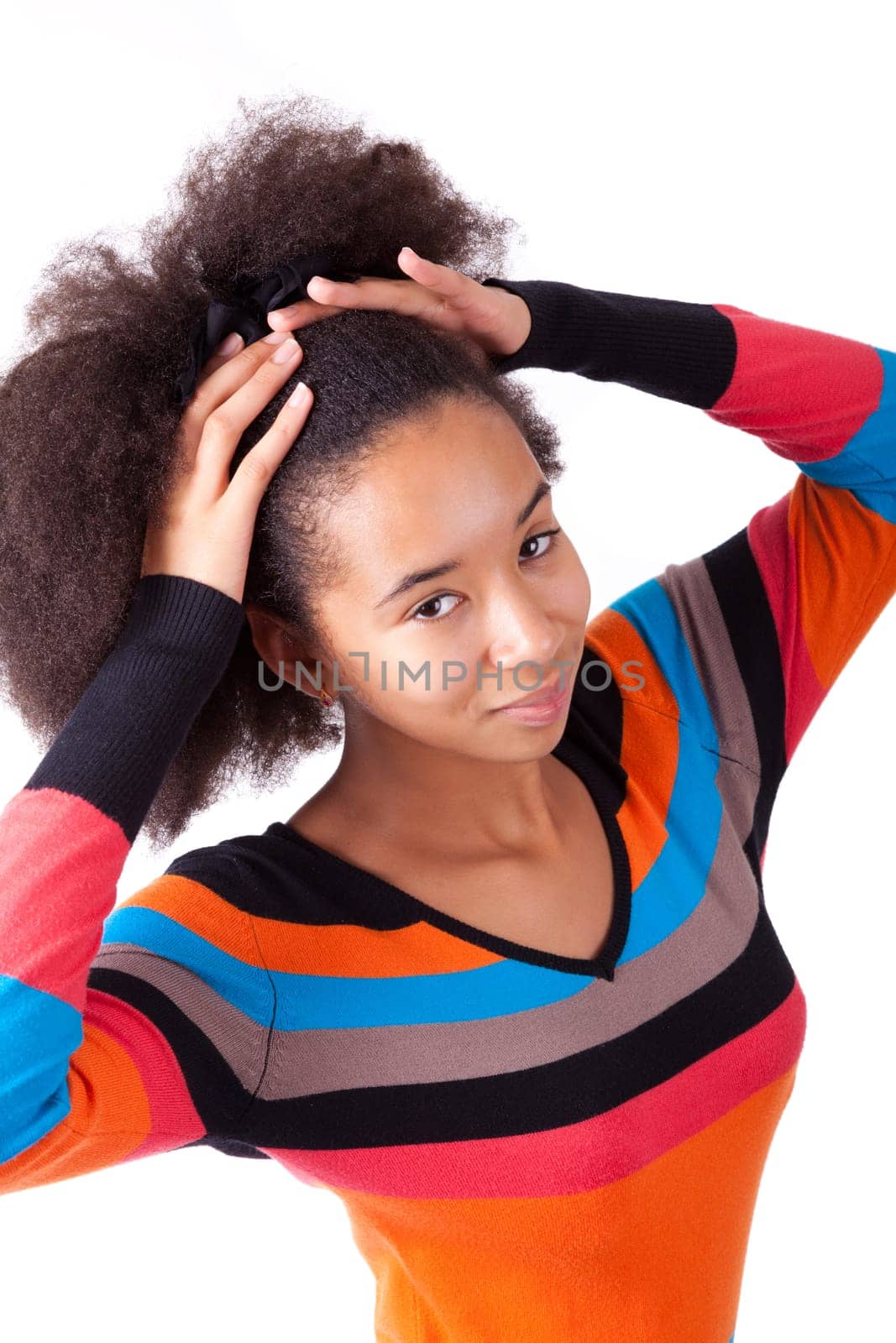 Black African American teenage girl holding her afro hair, isolated on white background