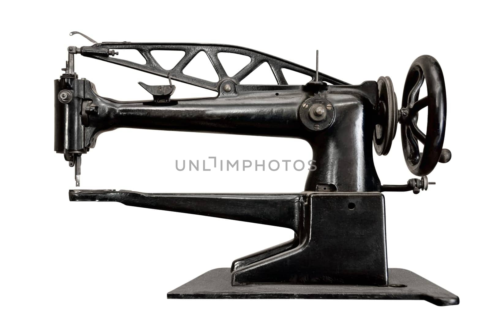 Ancient sewing machine isolated on white background