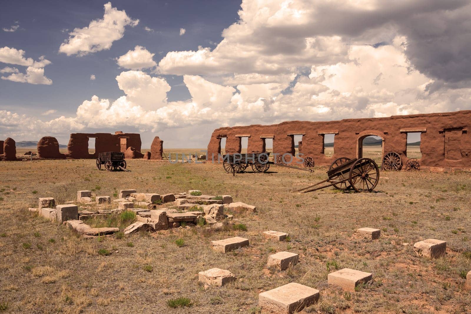 Ruins and wagons at Fort Union in sepia tone