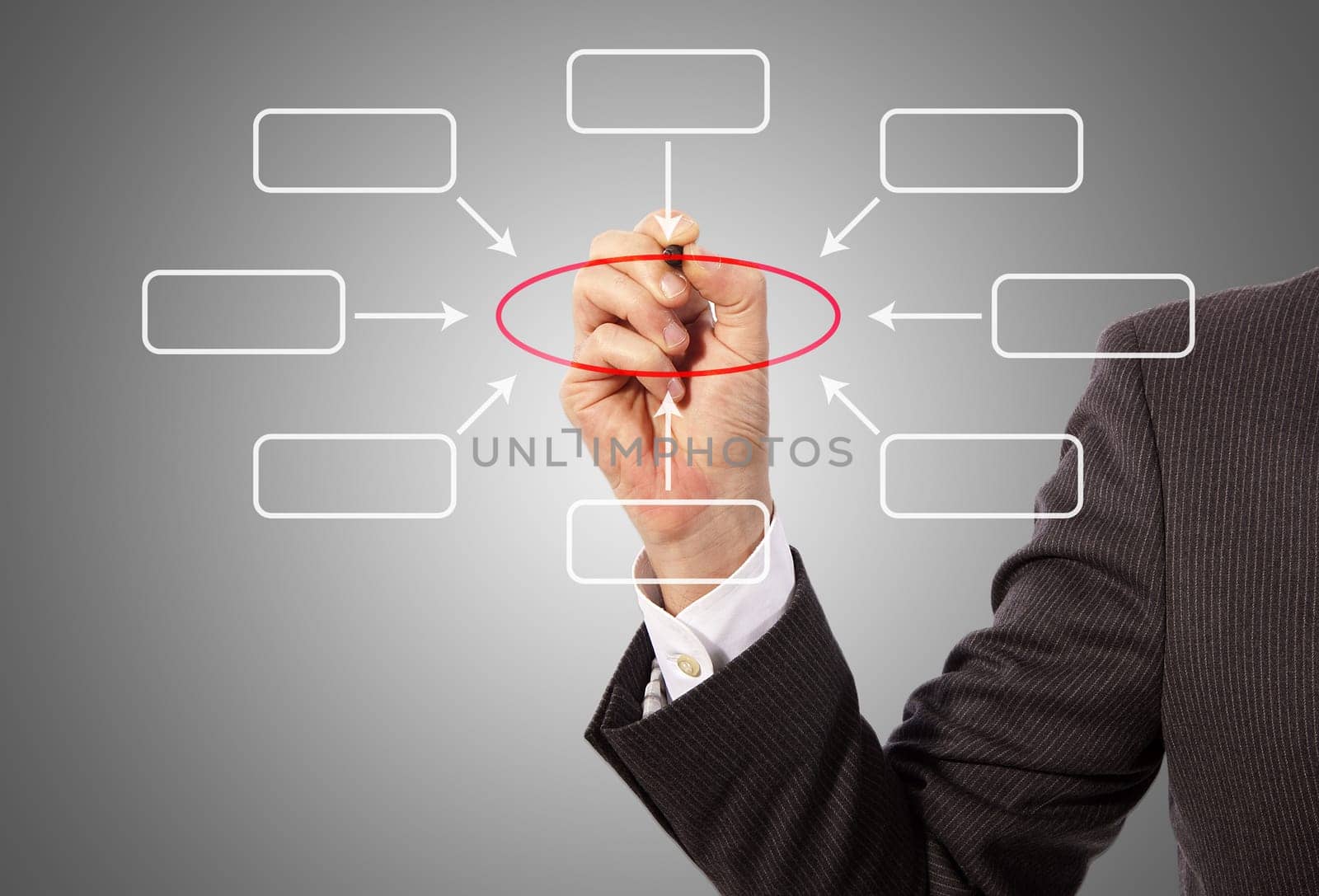 Male hand drawing a diagram, grey background