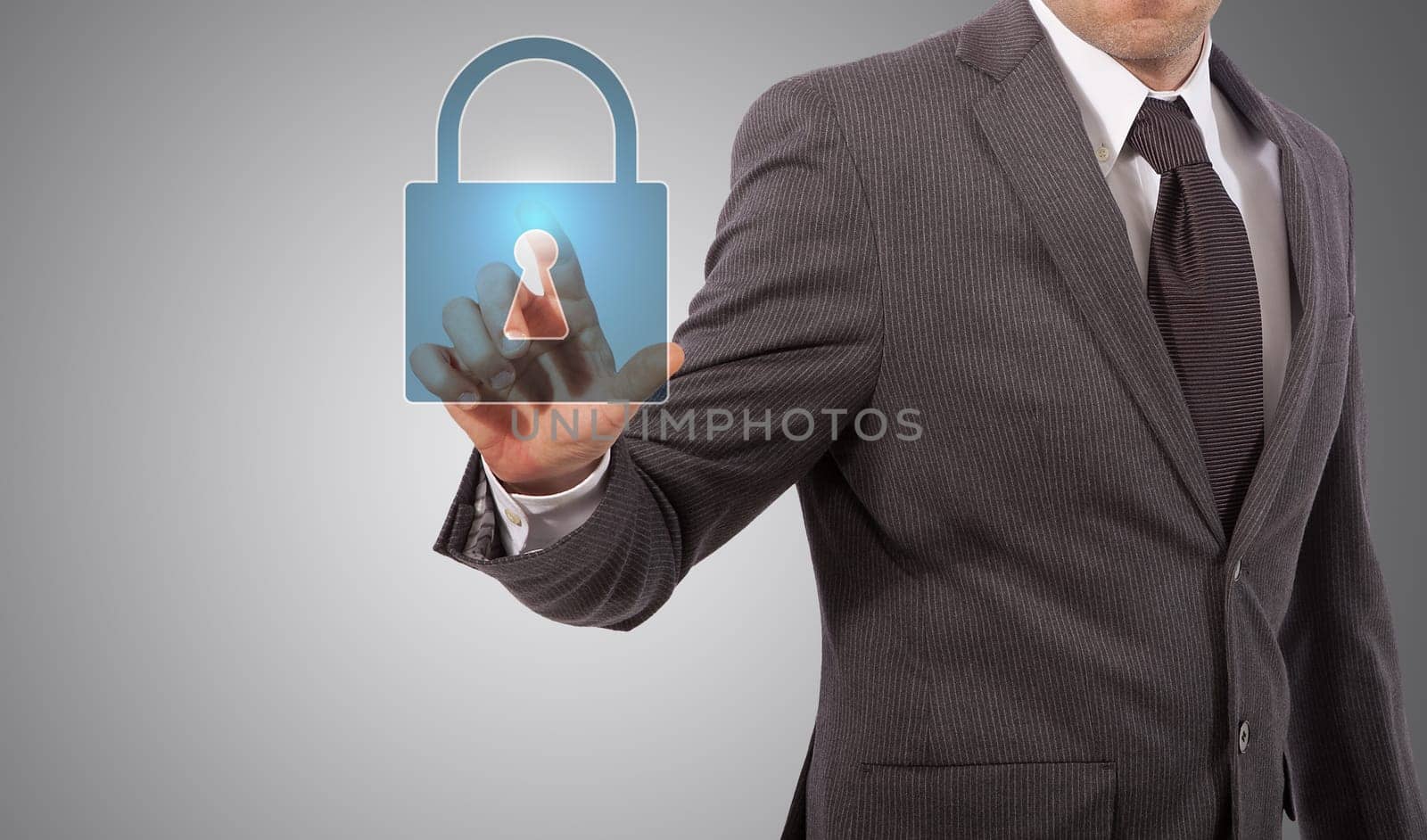 Businessman is pressing the security icon, grey background