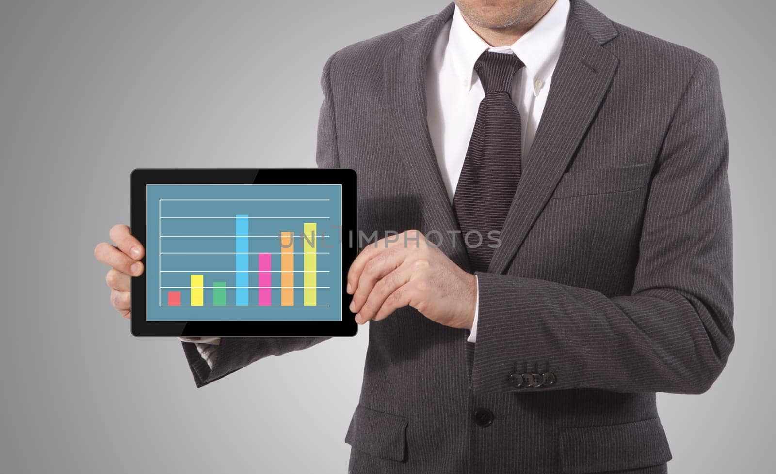 business man hand touch screen graph on a tablet