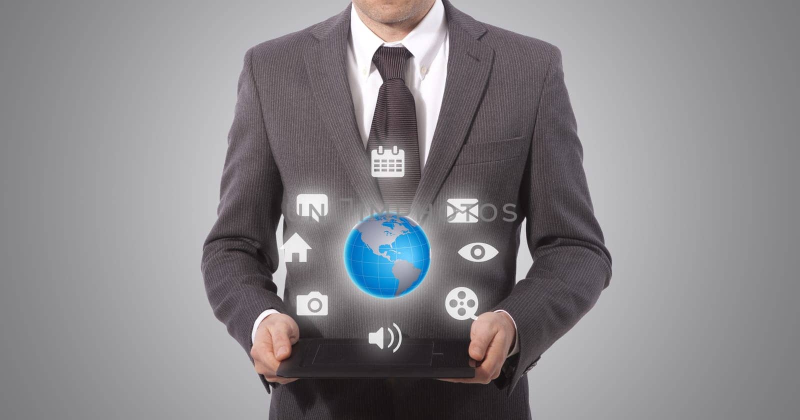 business man with touch tablet in hands, grey background. world map from www.lib.utexas.edu