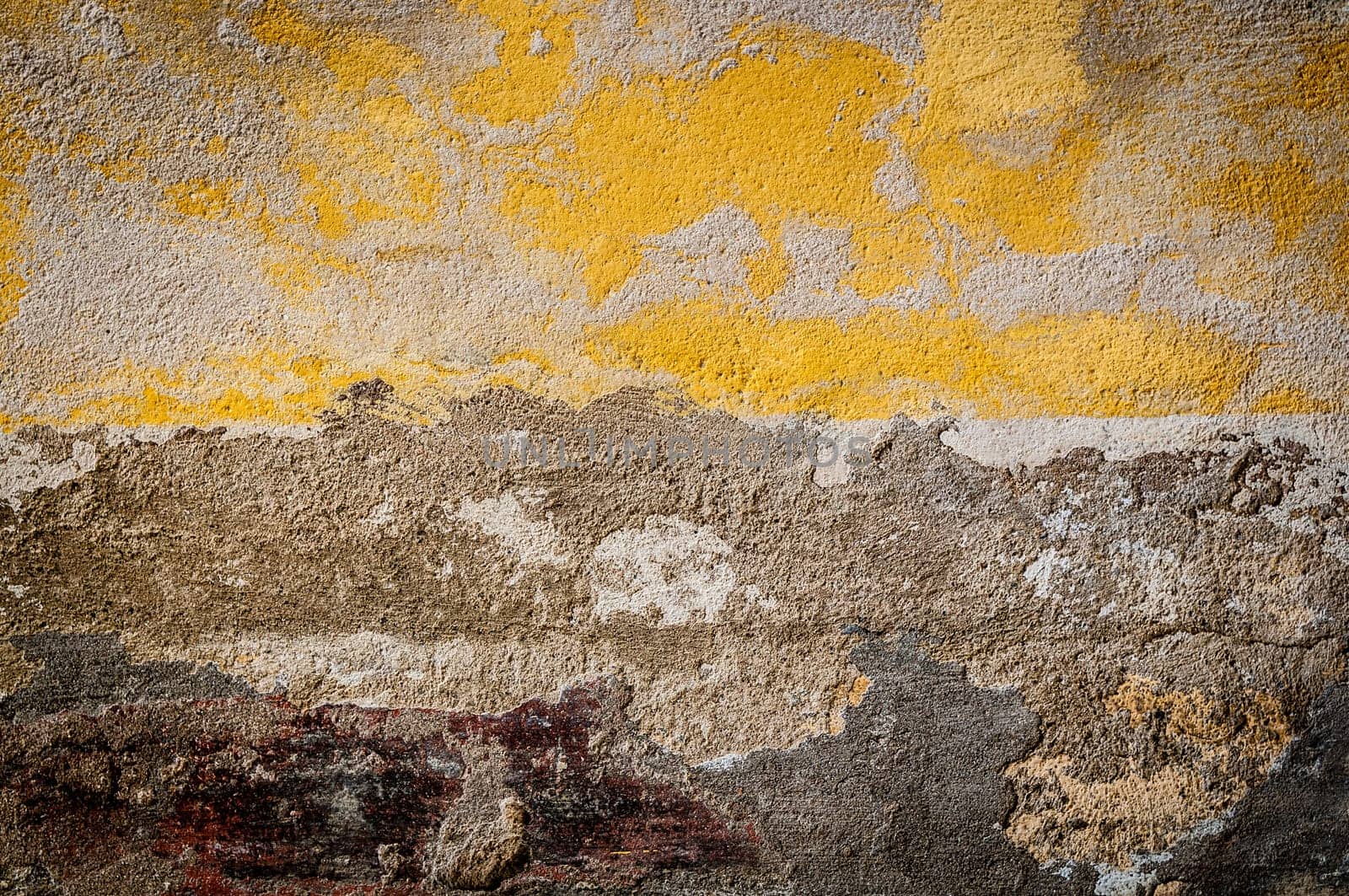 Grungy background. Old wall with some yellow color left on it. Lots of texture.