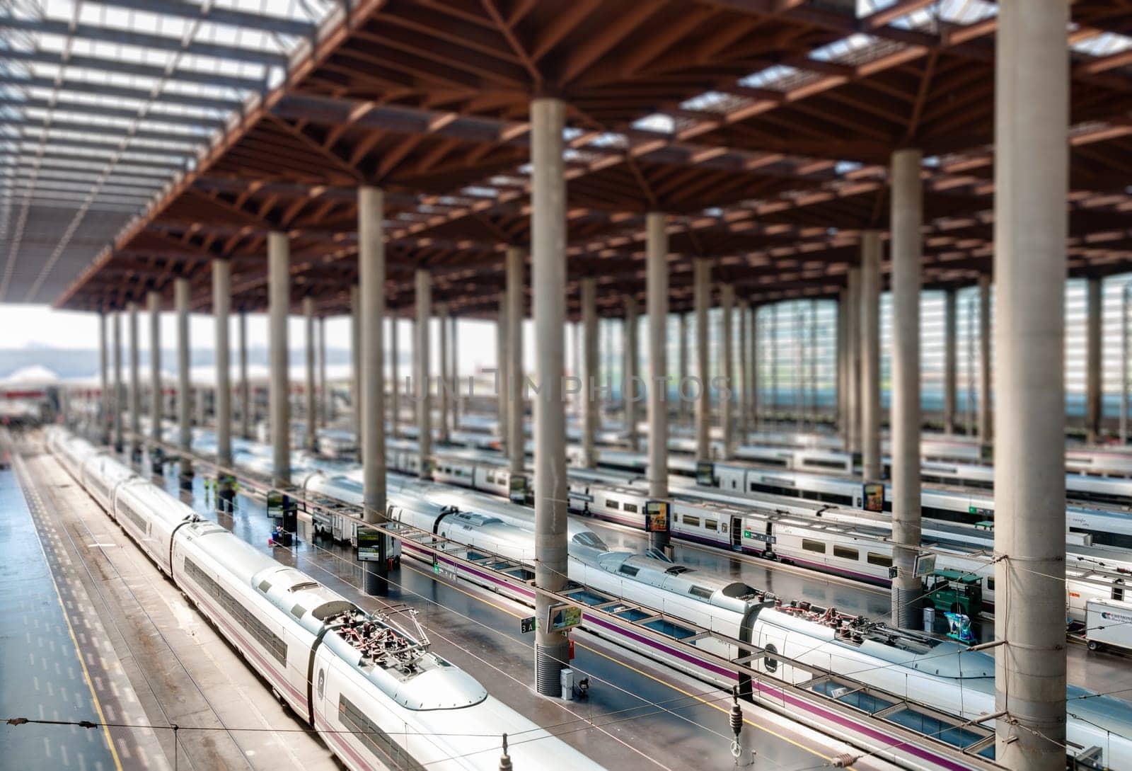 Atocha Madrid train station terminal. Modern station building with modern trains. Tilt shift effect. Madrid, Spain, Europe.