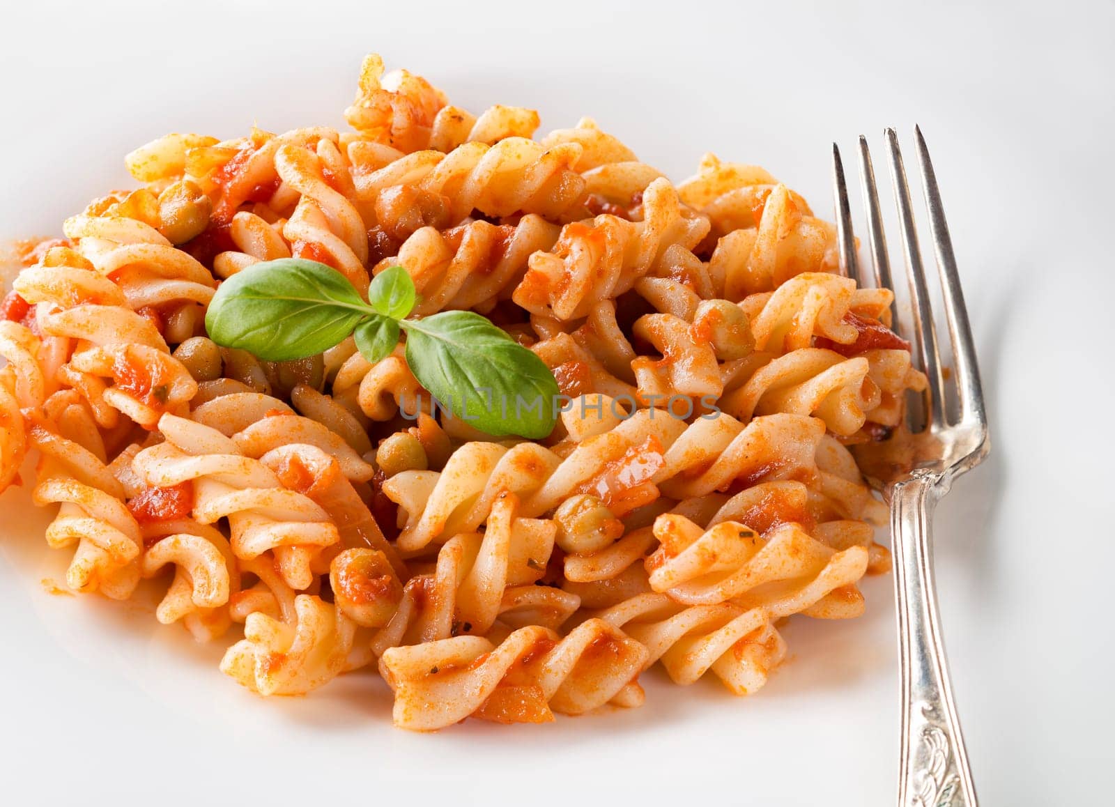 Dish of Italian pasta fusilli with fresh tomato sauce