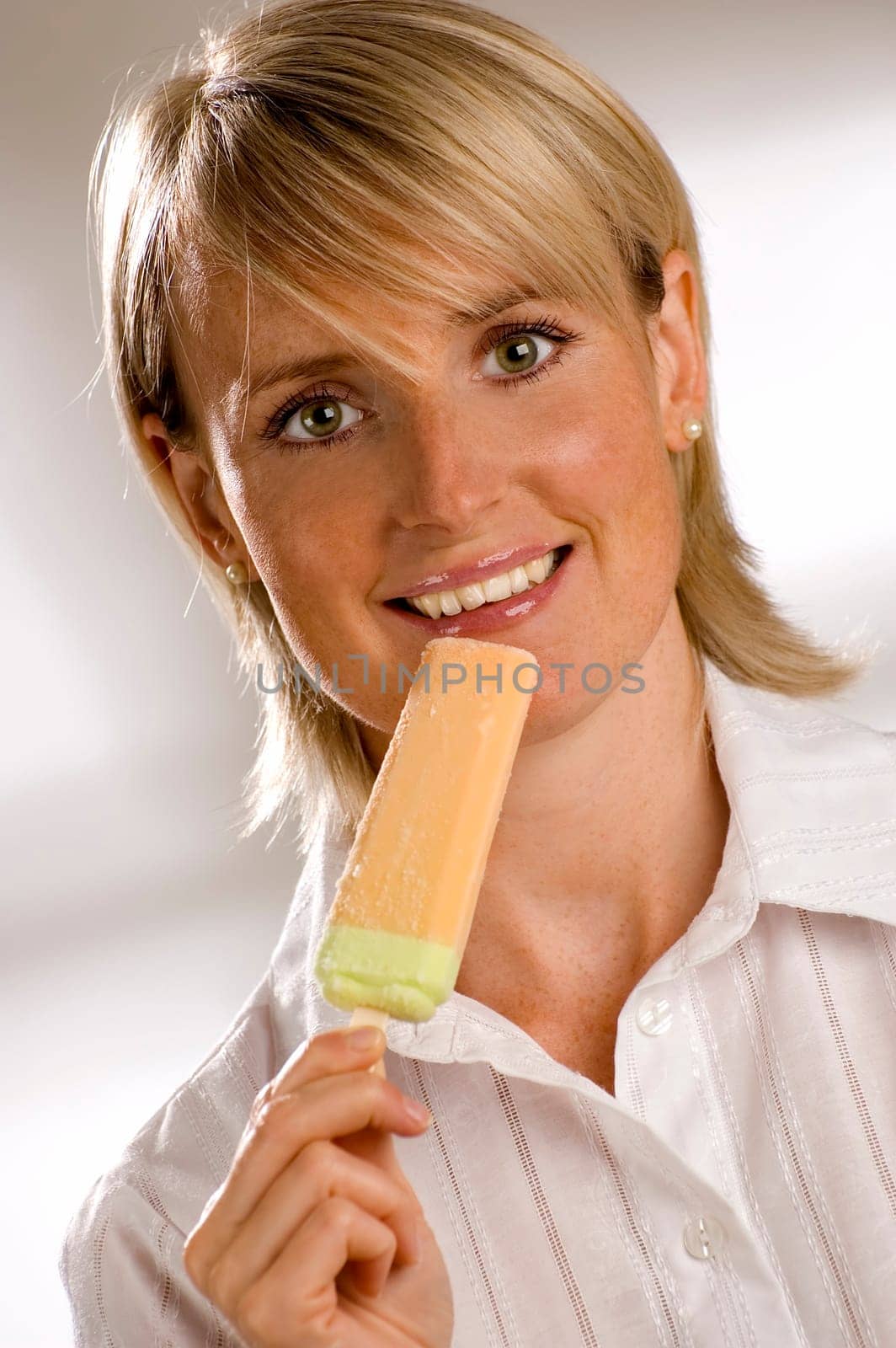 young girl eating ice cream close up