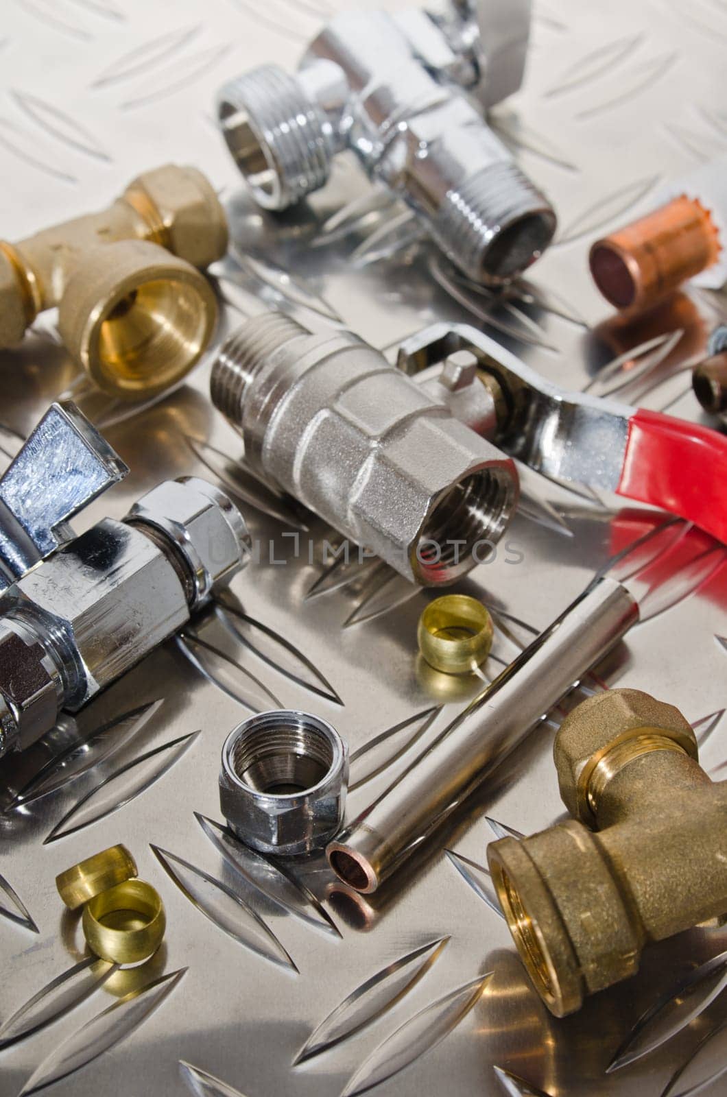 Plumbing inlet pipe valve on a metal surface