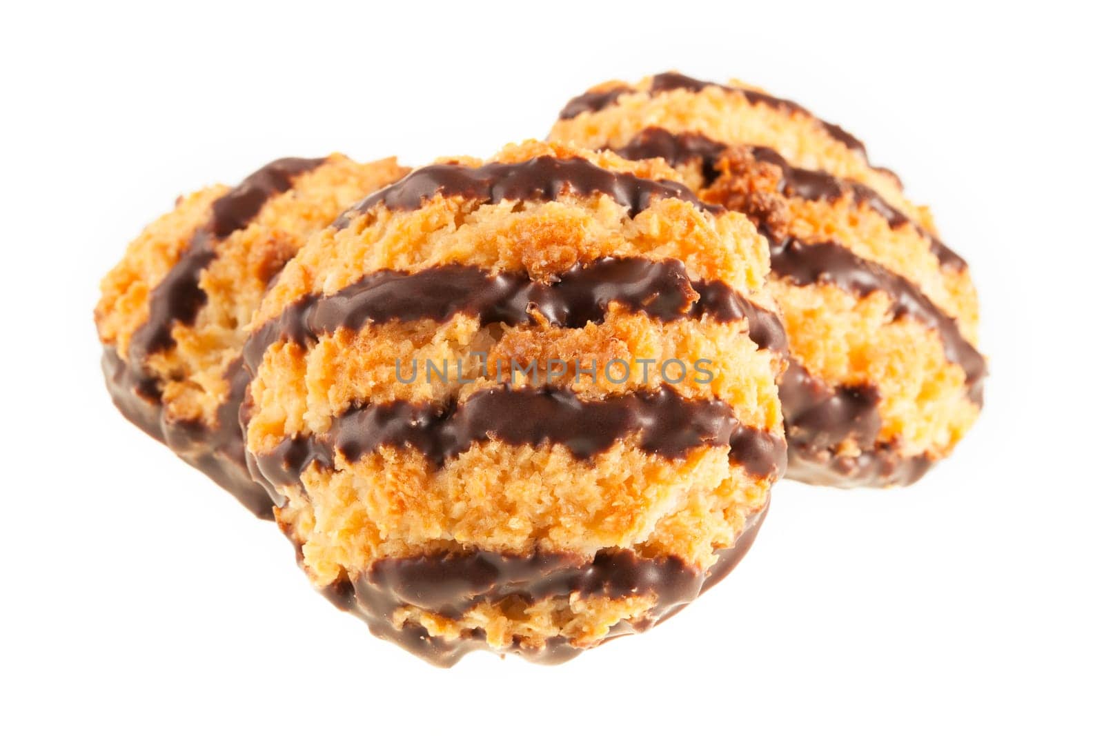 Three coconut macaroons with chocolate isolated on a white background