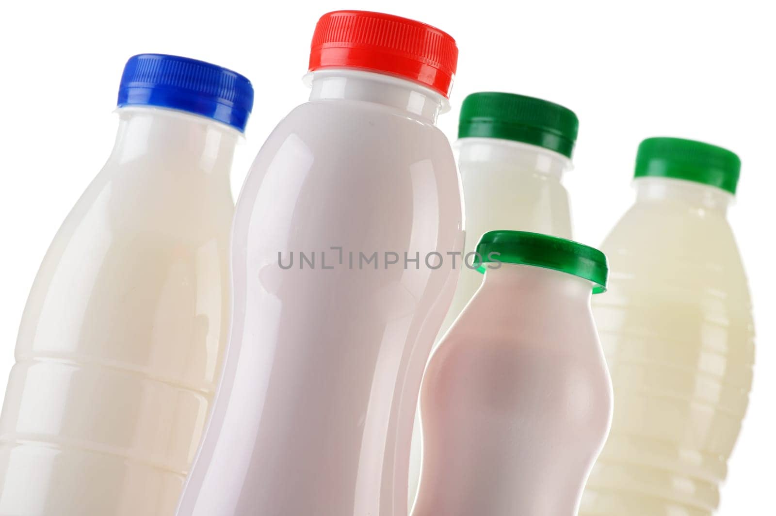 Composition with plastic bottles of milk products