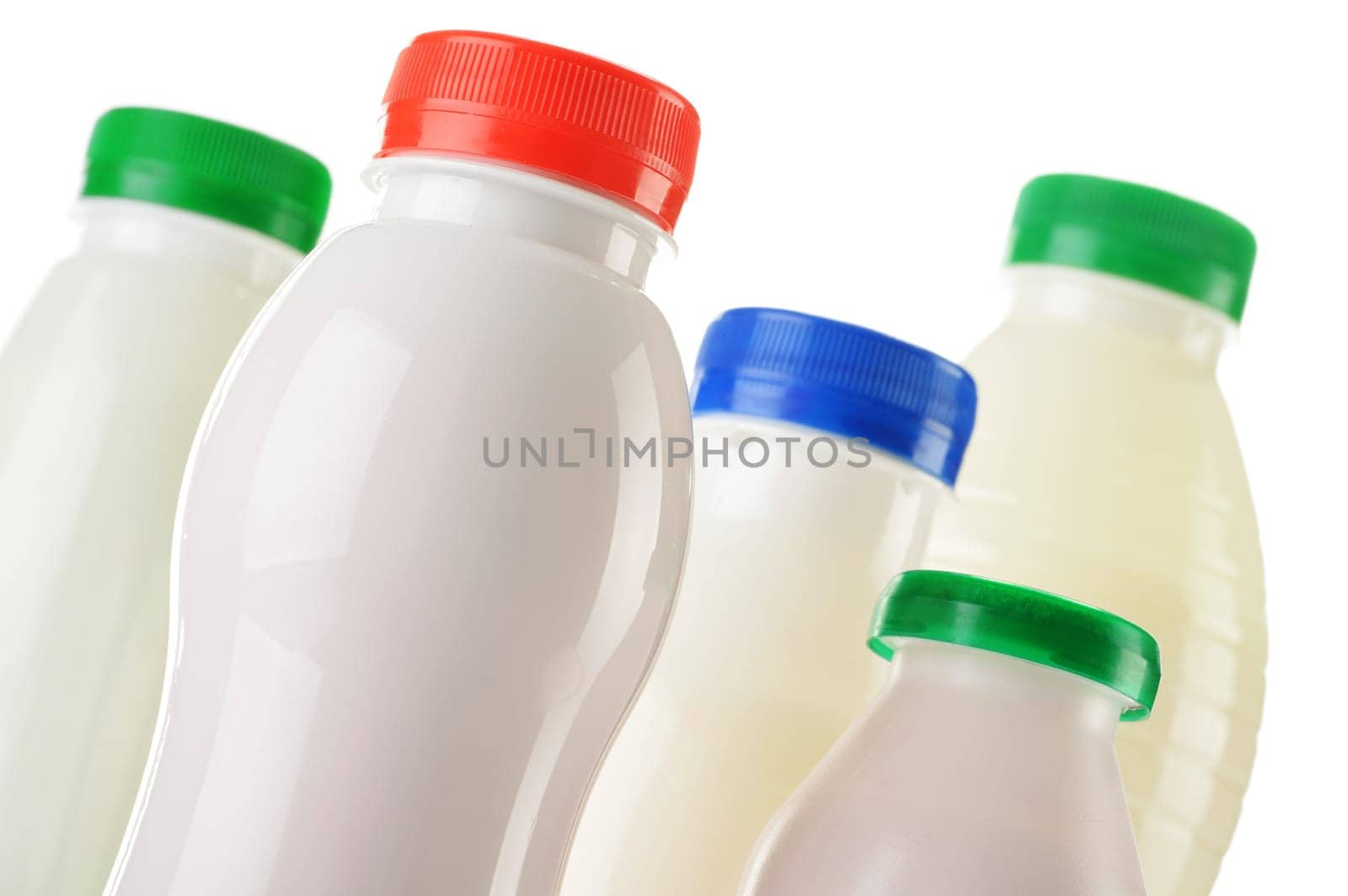Composition with plastic bottles of milk products
