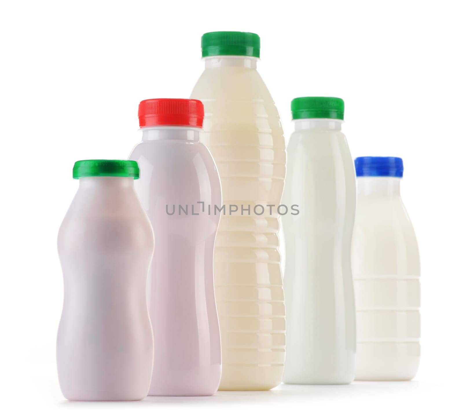 Composition with plastic bottles of milk products