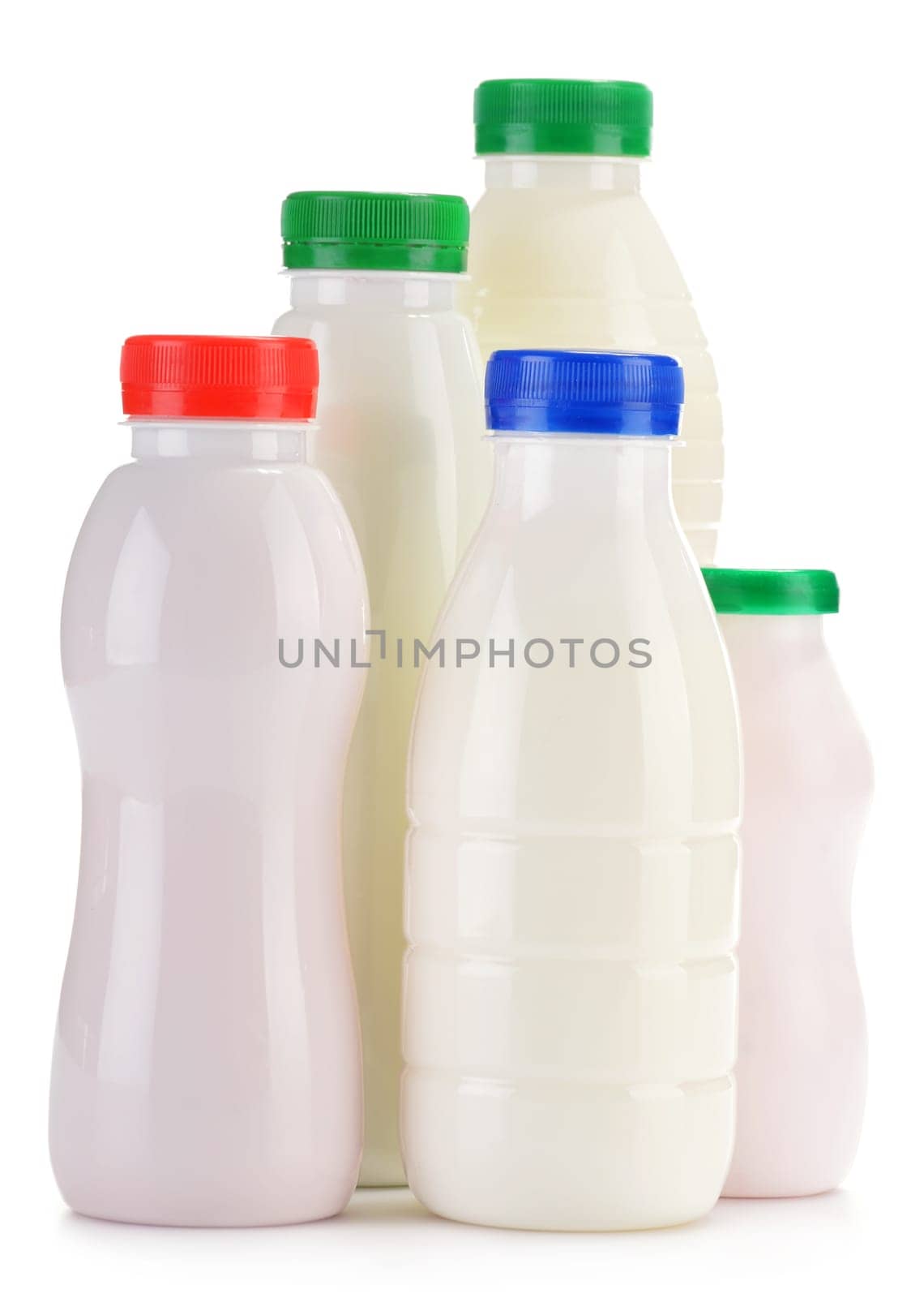 Composition with plastic bottles of milk products