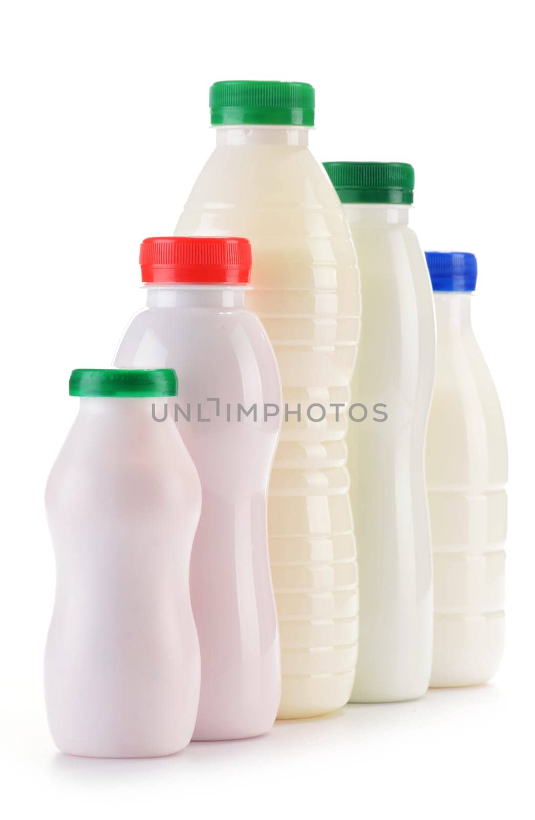 Composition with plastic bottles of milk products