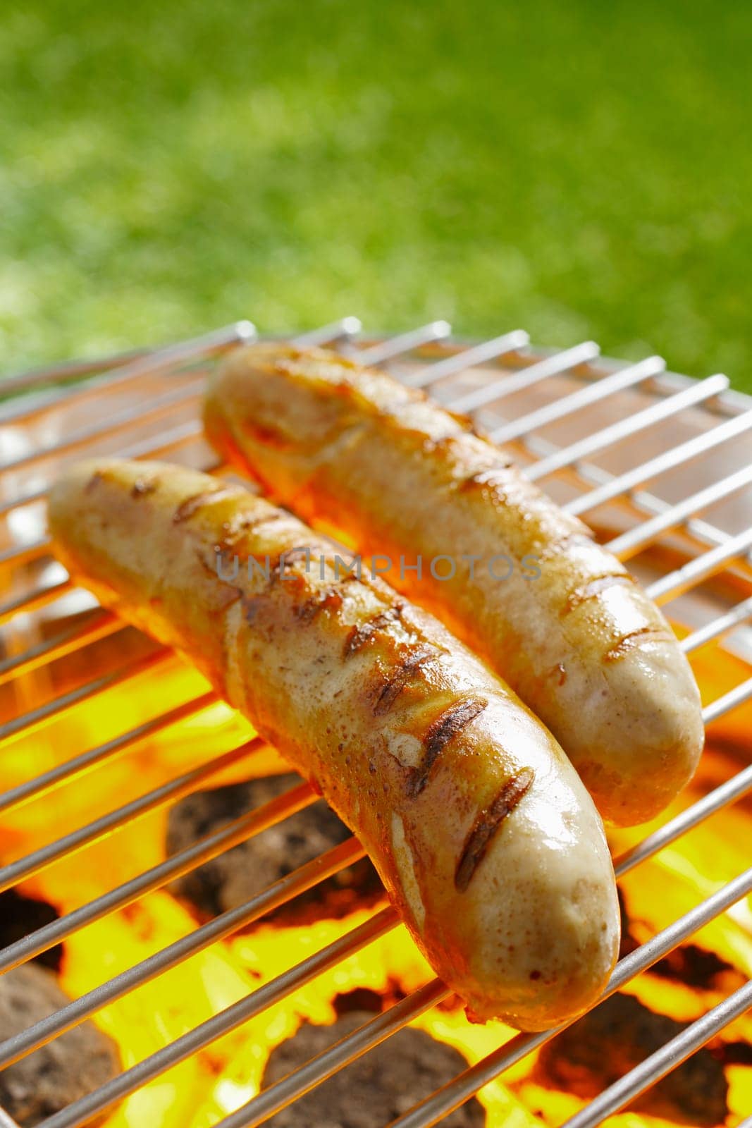 Grilled Bratwurst on the grilling pan outdoors