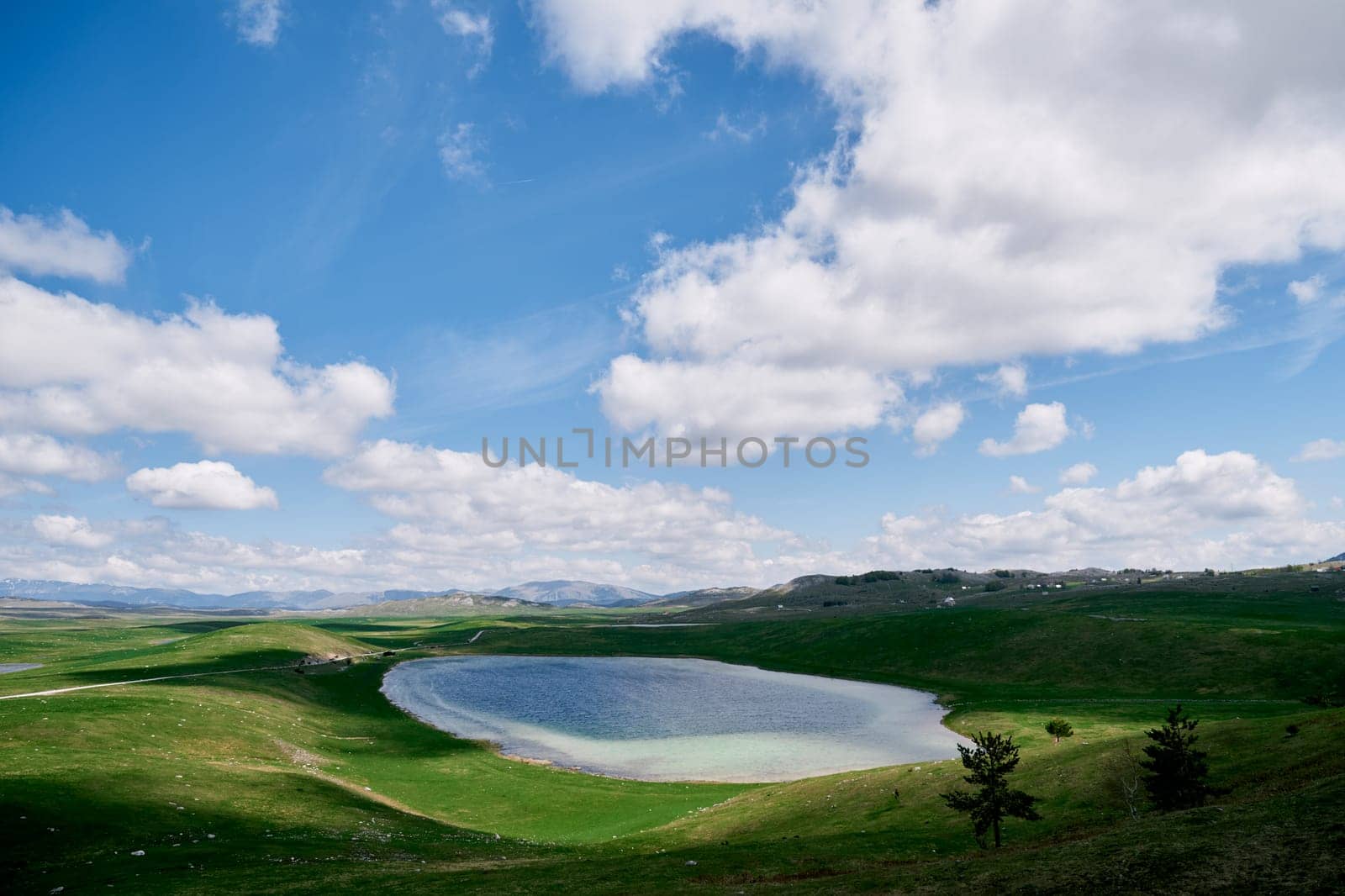 Vrazje lake in the shadow of clouds in a green valley. Durmitor, Montenegro. High quality photo