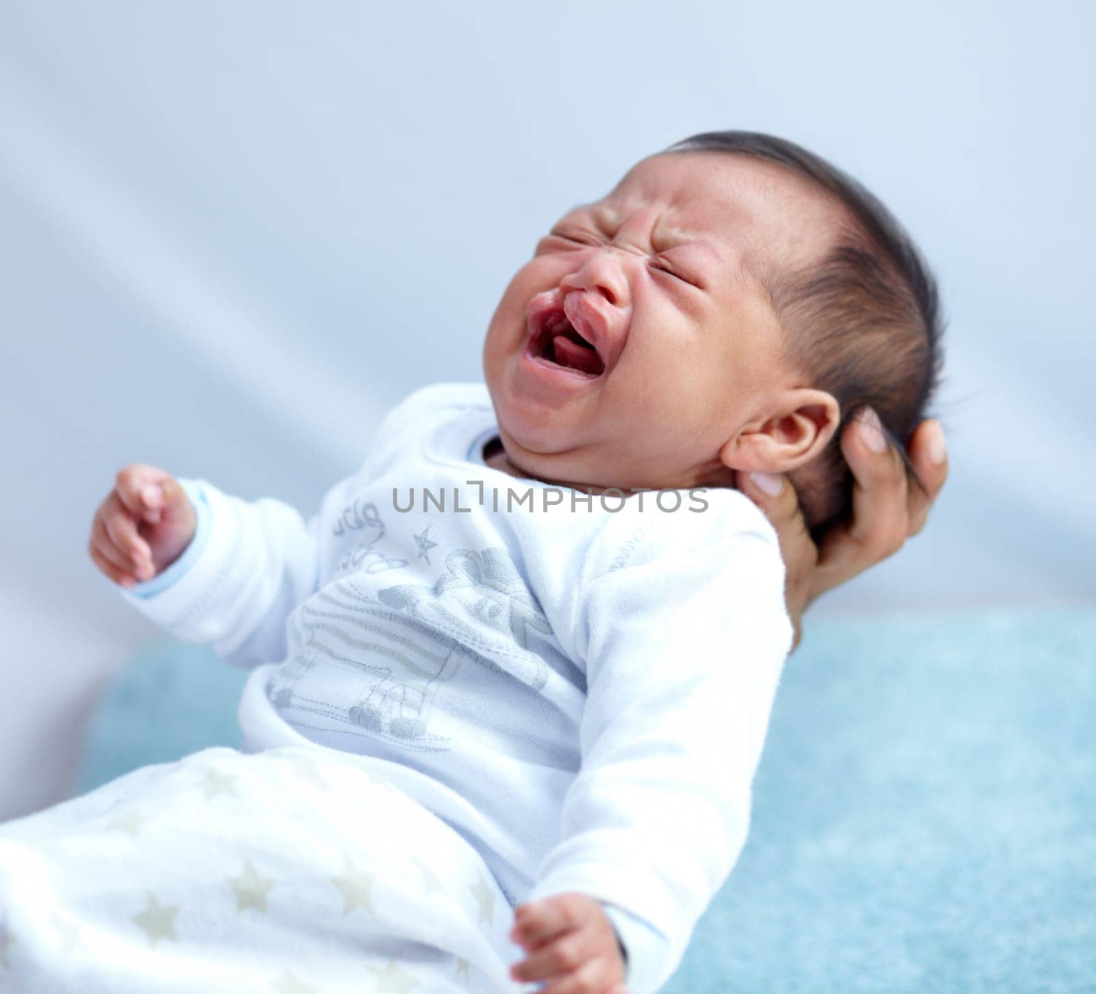 Newborn, crying and cleft palate with parent, mom and home with tears, sick and frustrated. Medical child, syndrome and house bedroom for healthcare, childcare and mouth for baby, pain and sadness by YuriArcurs