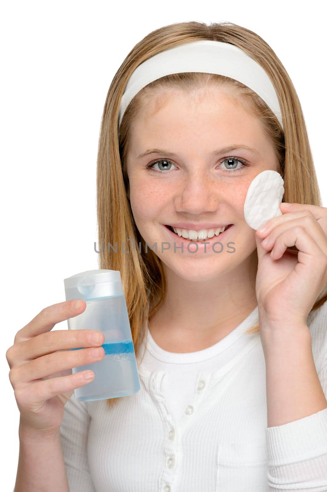 Cheerful smiling girl removing cleaning make-up face lotion