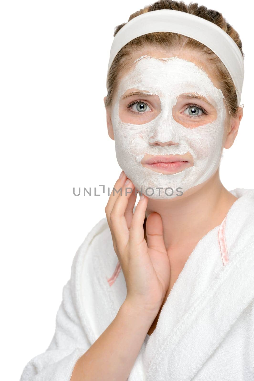 Anxious teenager girl applying face mask cleaning treatment cosmetics