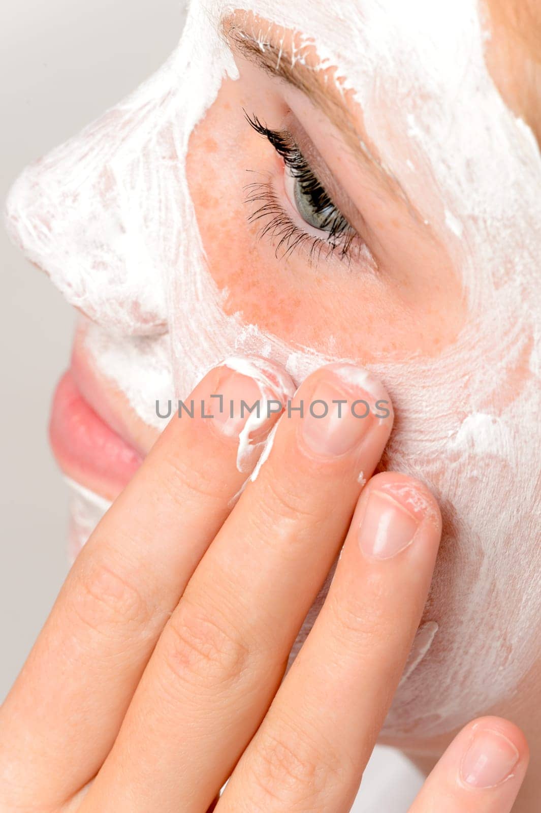 Applying mask fingers young girl beauty treatment skin purity