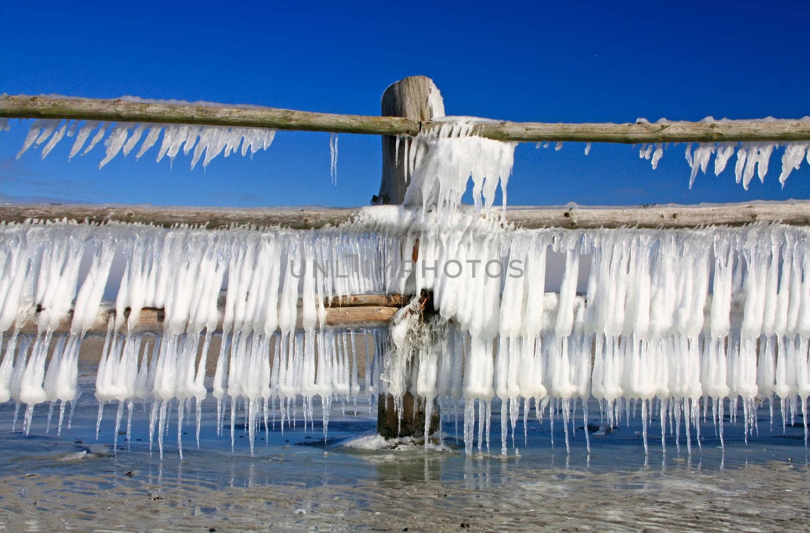 Icicles on a wooden fence at the Baltic Sea,Western Pomerania Lagoon Landscape National Park,Mecklenburg-Western Pomerania,Germany