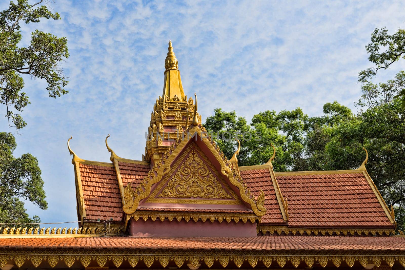 Oriental temple decorated with a golden roof in Siem Reap, Cambodia
