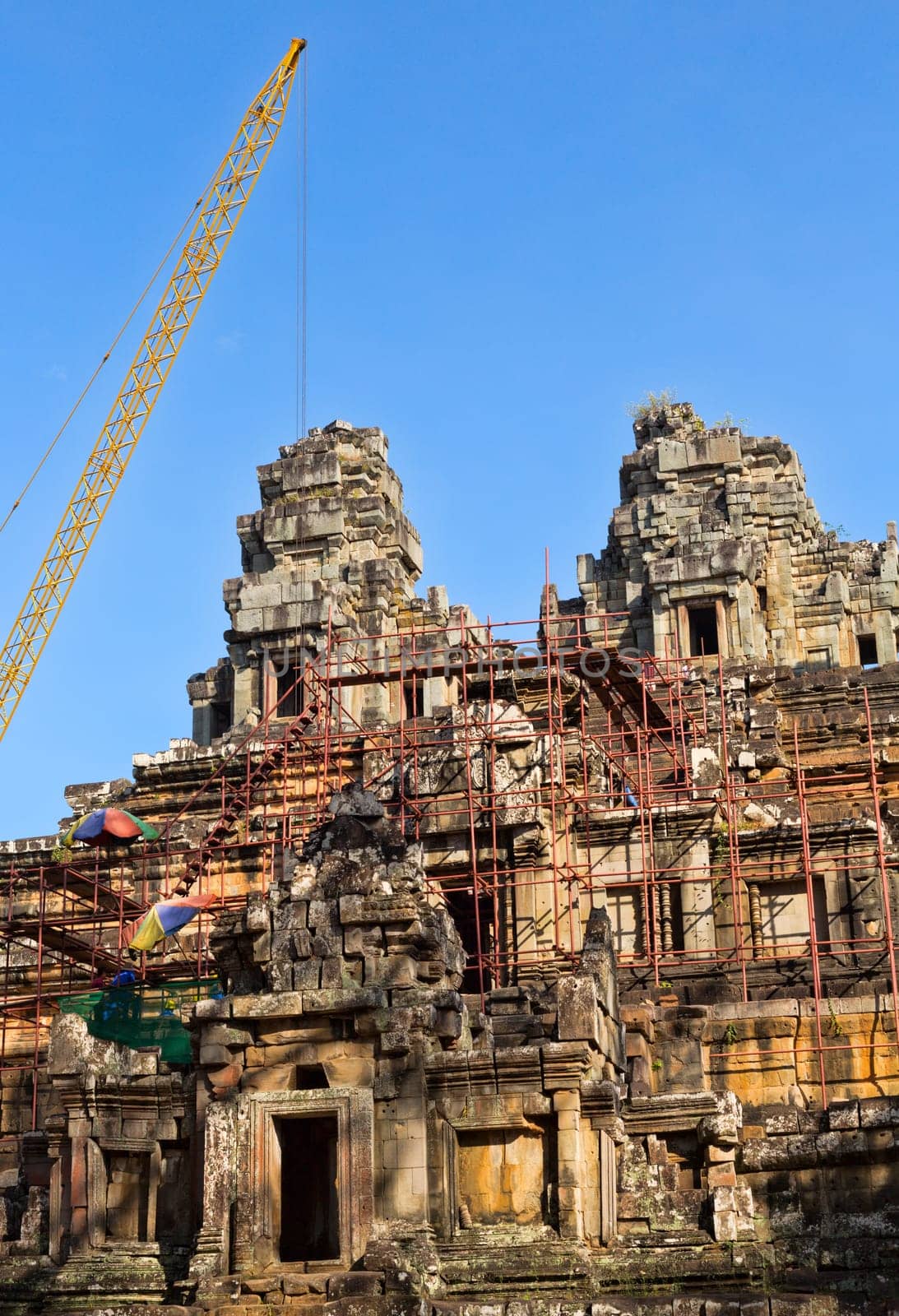 Tower crane in the temple of Angkor Wat. Reconstruction of the temple complex of the UNESCO.