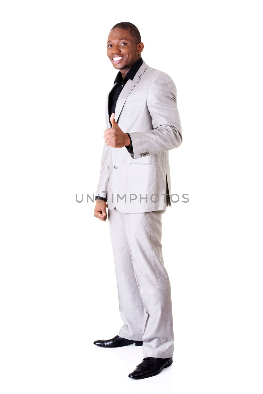 Happy successful businessman gesturing OK - thumbs up. Isolated on white.