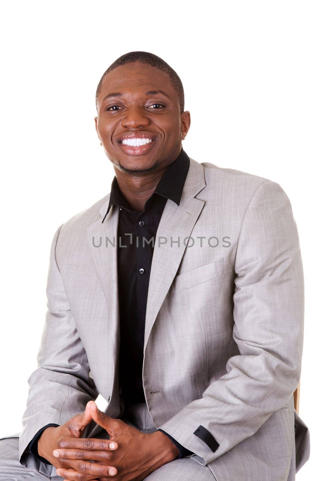 Happy smart black businessman smiling, isolated on white.
