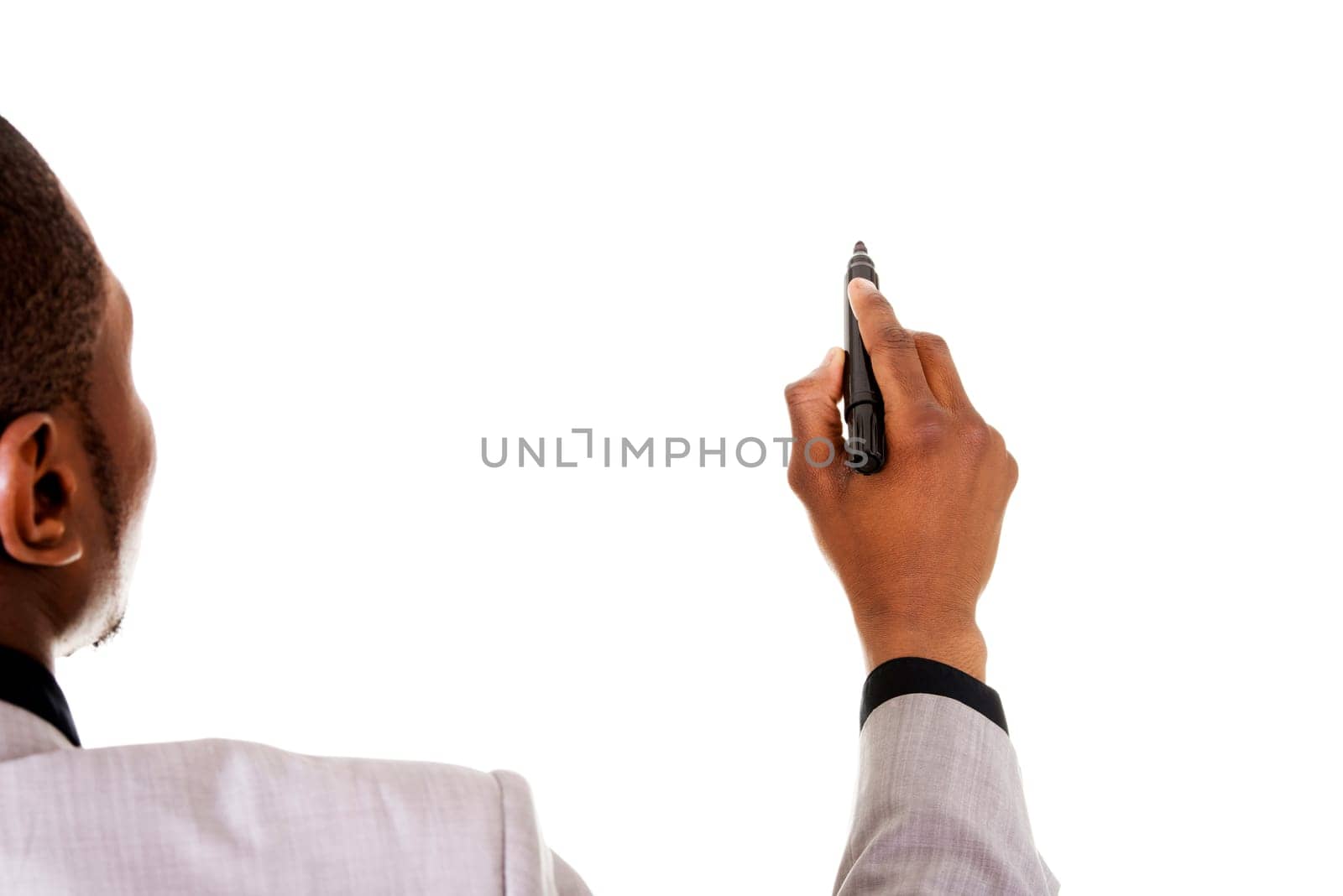 Businessman drawing something abstract with black marker, isolated on white background