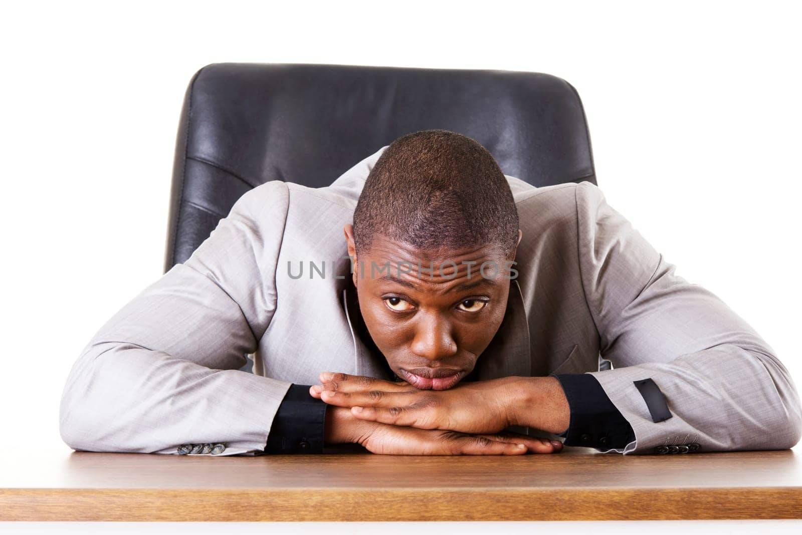 Sad, tired or depressed businessman at the desk.