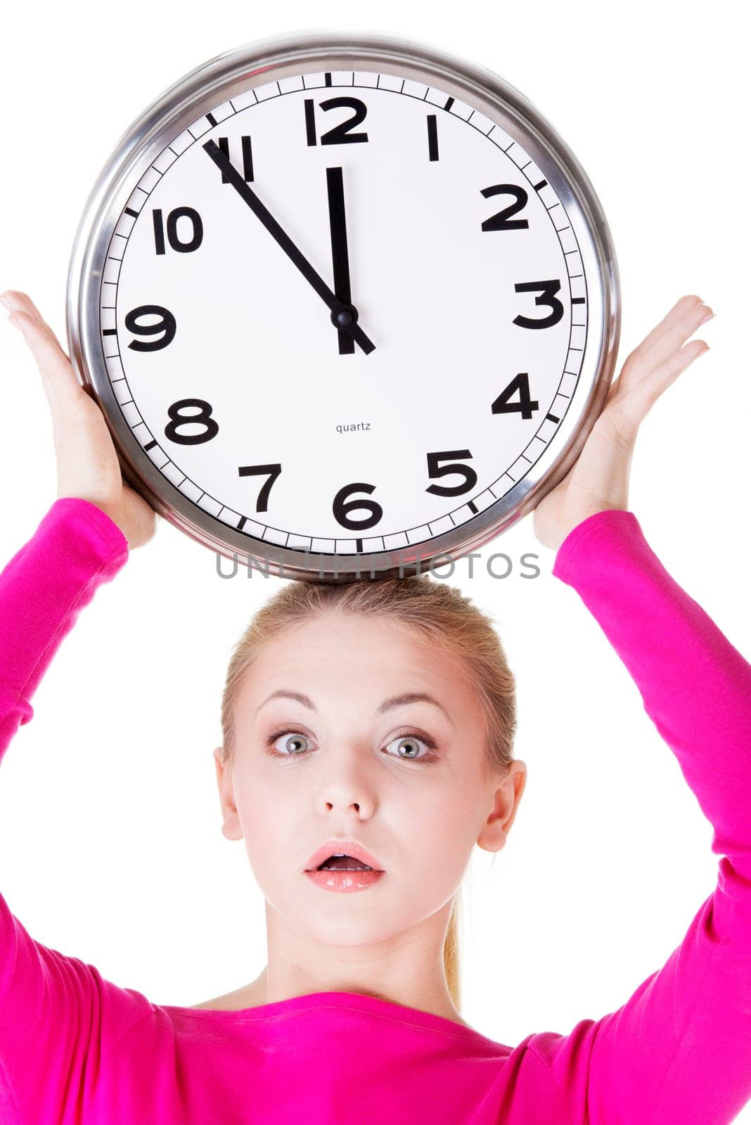 Portrait of shocked woman with clock over white background