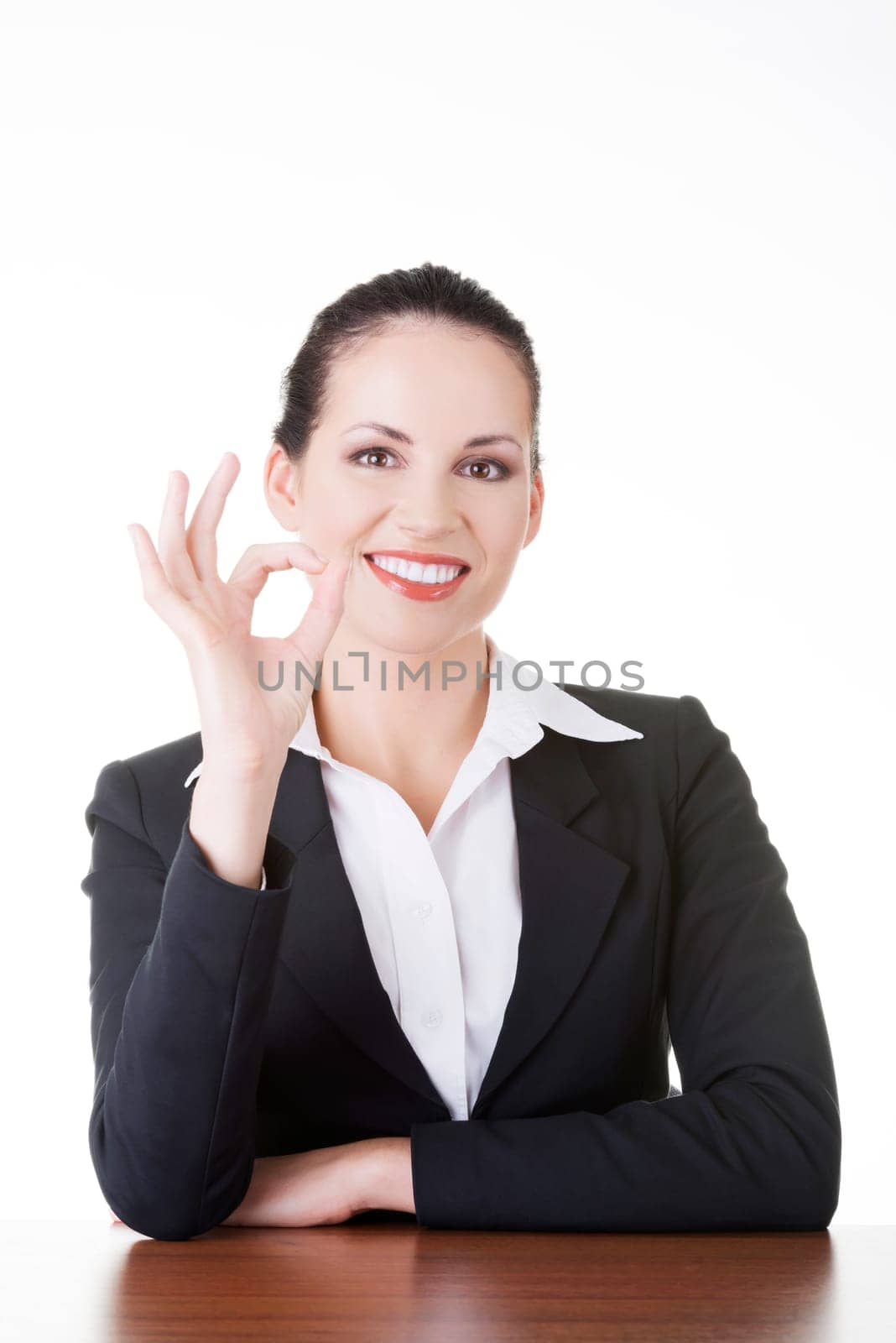 Young woman at the desk gesturing perfect , isolated on white