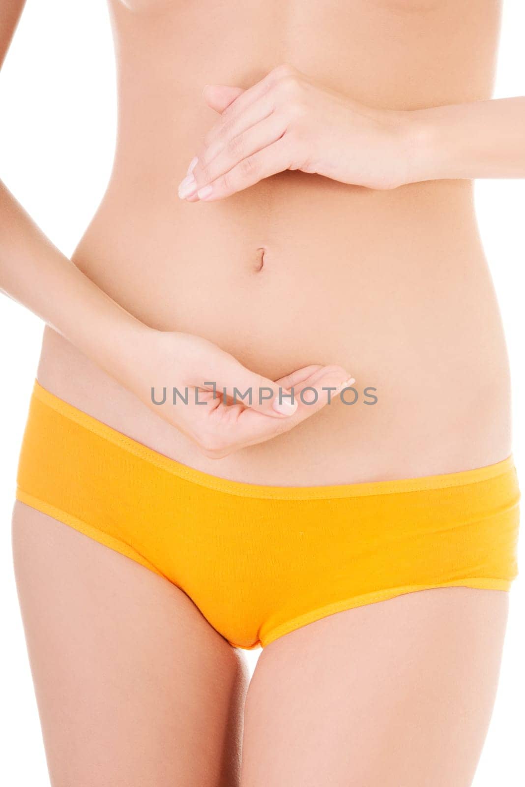 Fit and slim young woman belly with hand on it