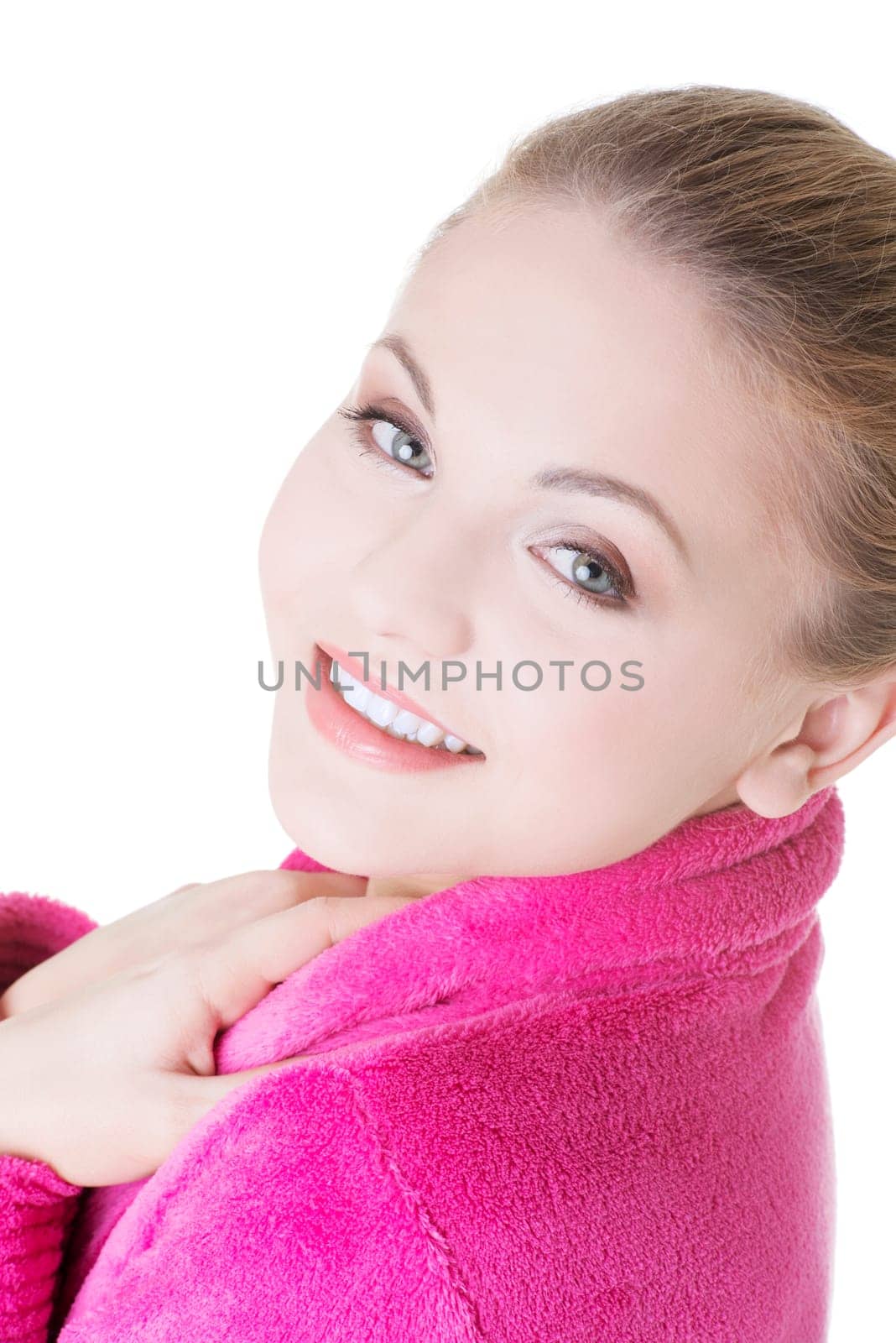 Young beautiful happy blond woman in bathrobe, isolated on white