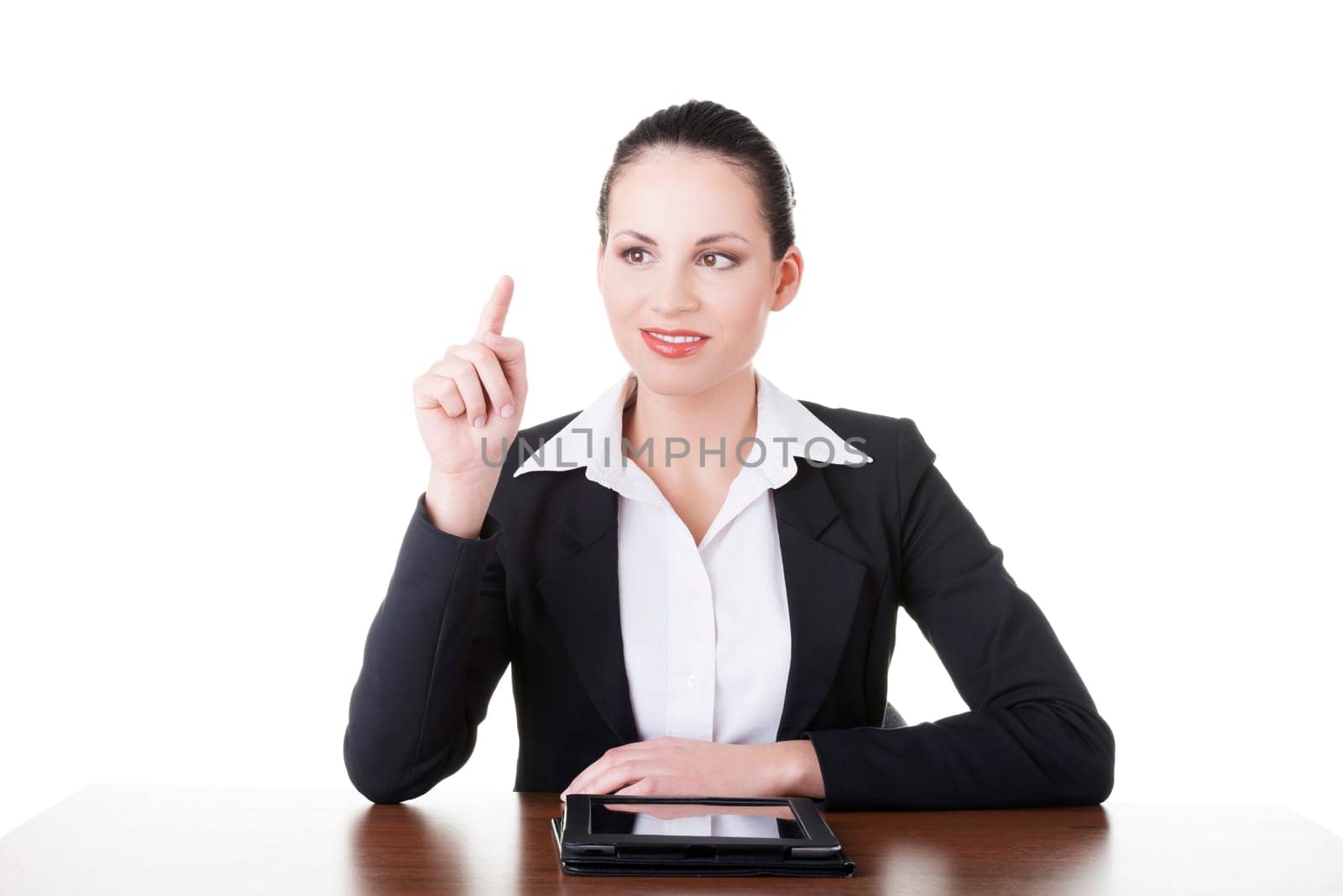 Businesswoman working on tablet computer with touch pad. Isolated on white.