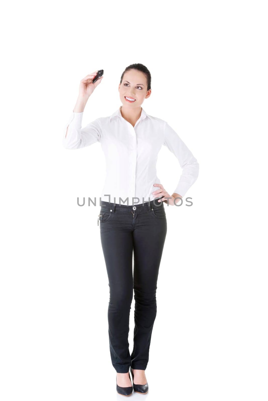 Young businesswoman writing something on abstract screen