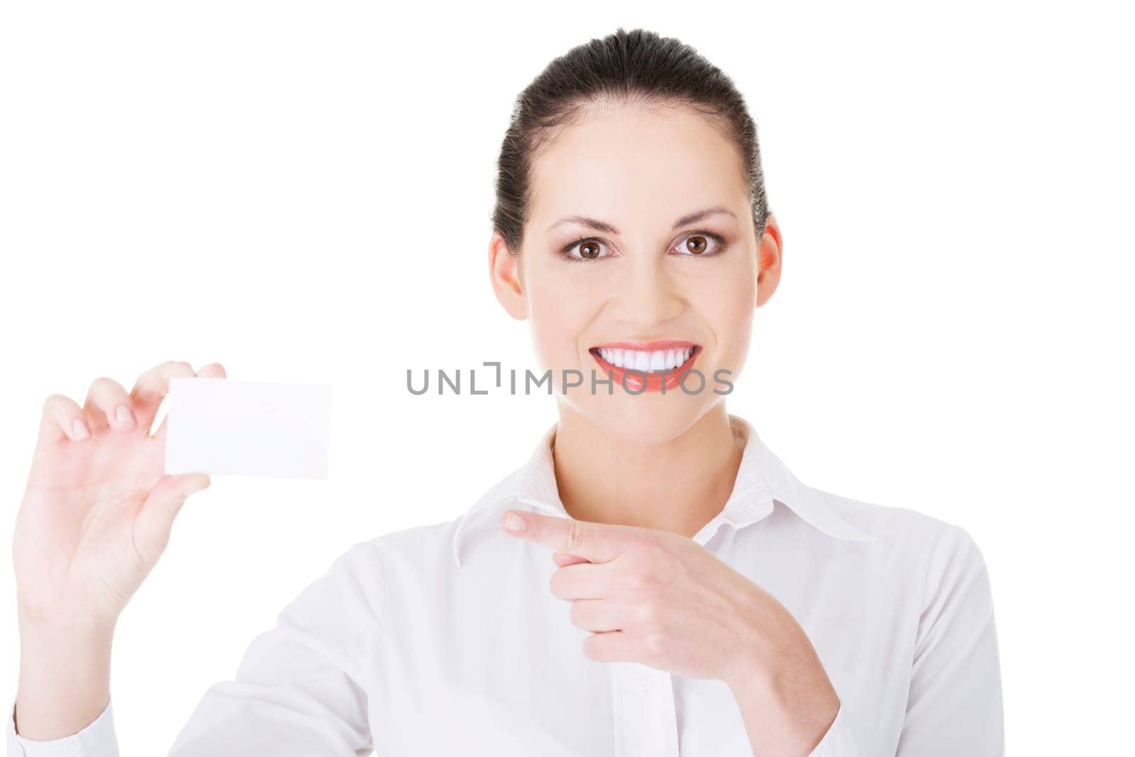Beautiful smiling businesswoman with businesscard. Isolated on white