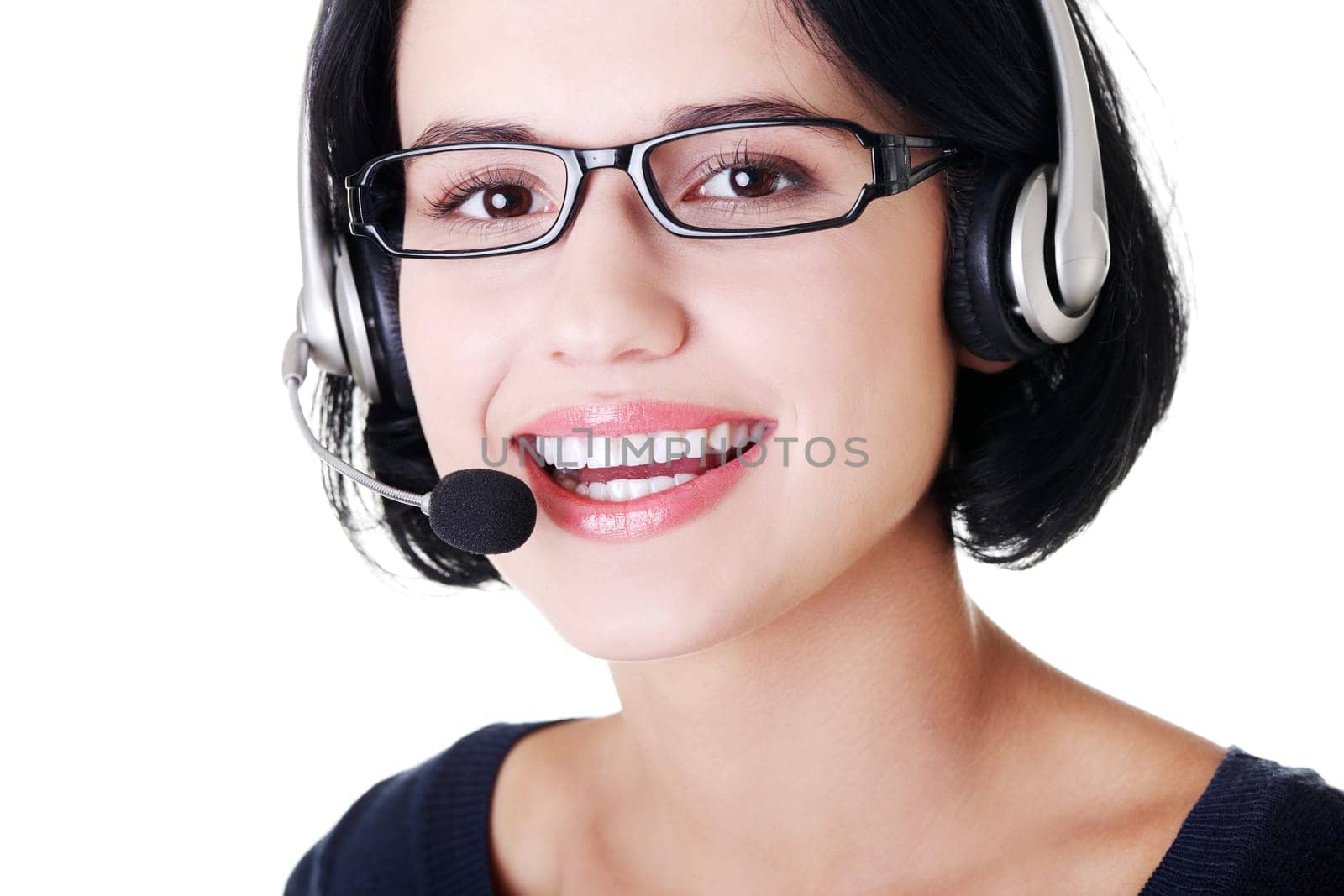 Closeup of attractive customer support representative smiling with headset